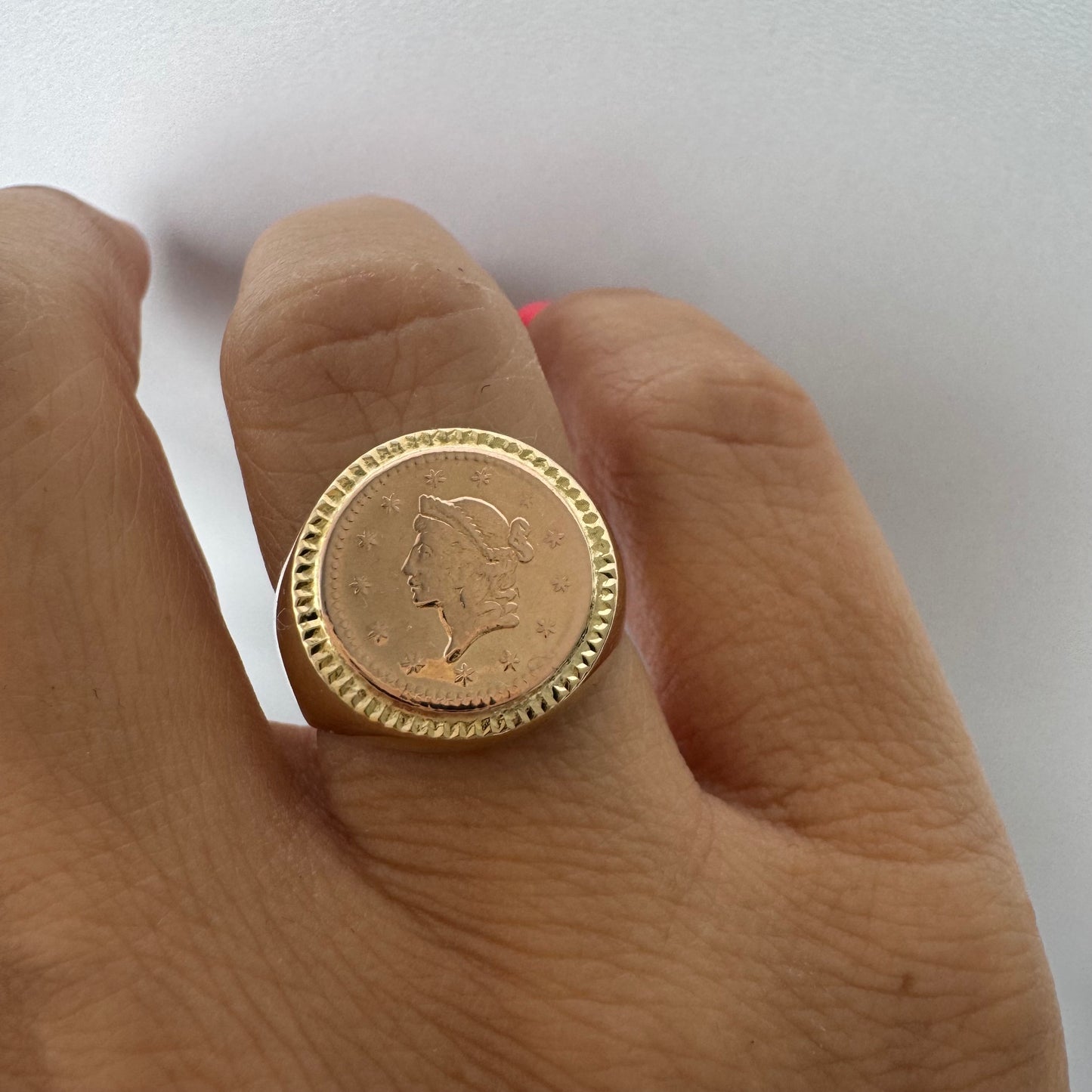 18K gold coin ring set with an authentic 22K gold coin at the center.