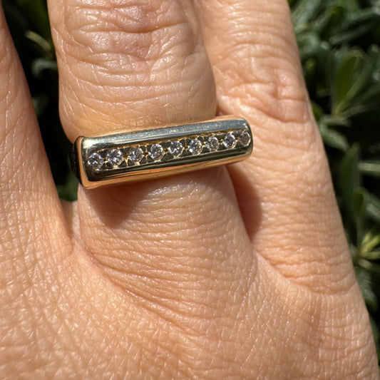 14K gold ring set with a row of Diamonds