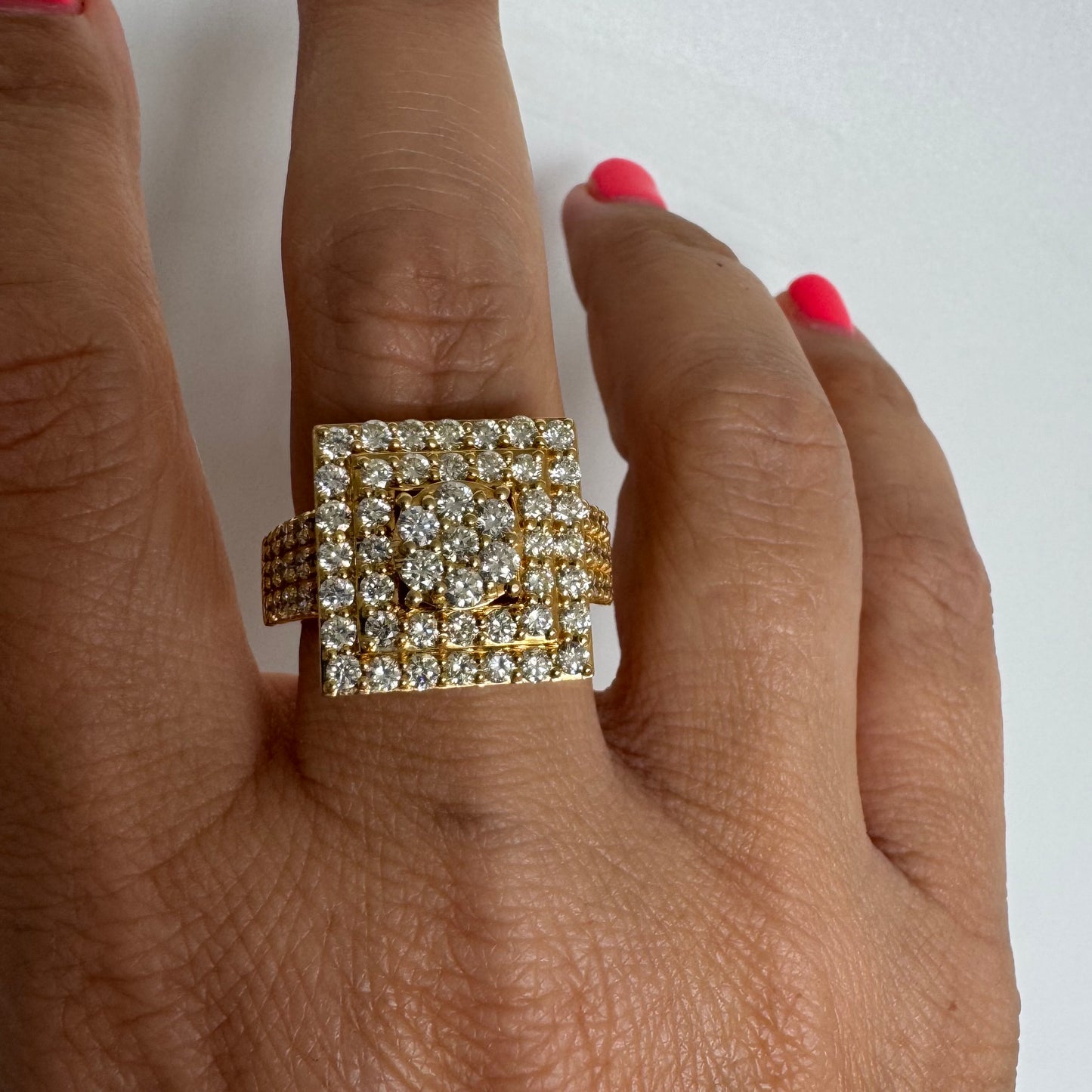 10K gold ring featuring a bold geometric design beautifully set with sparkling Diamonds