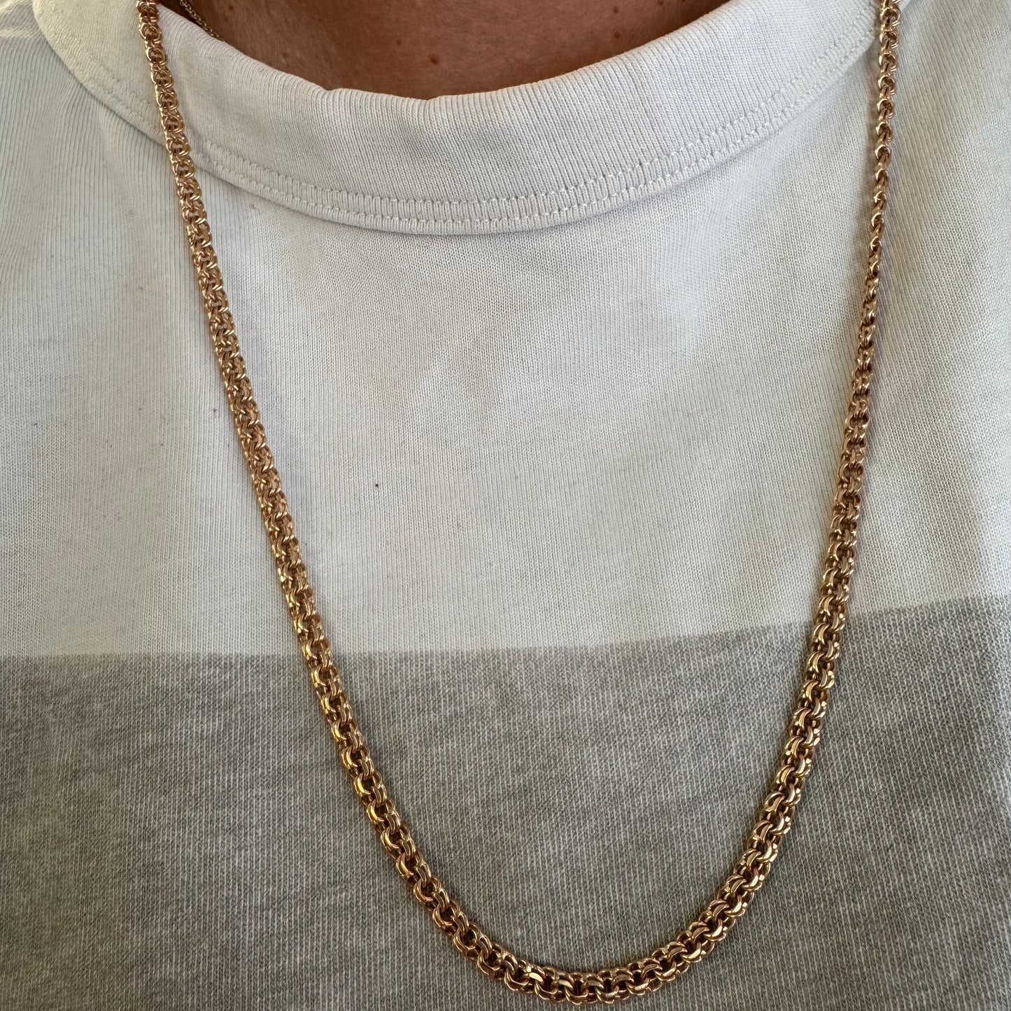 14K gold chain featuring an intricate woven link