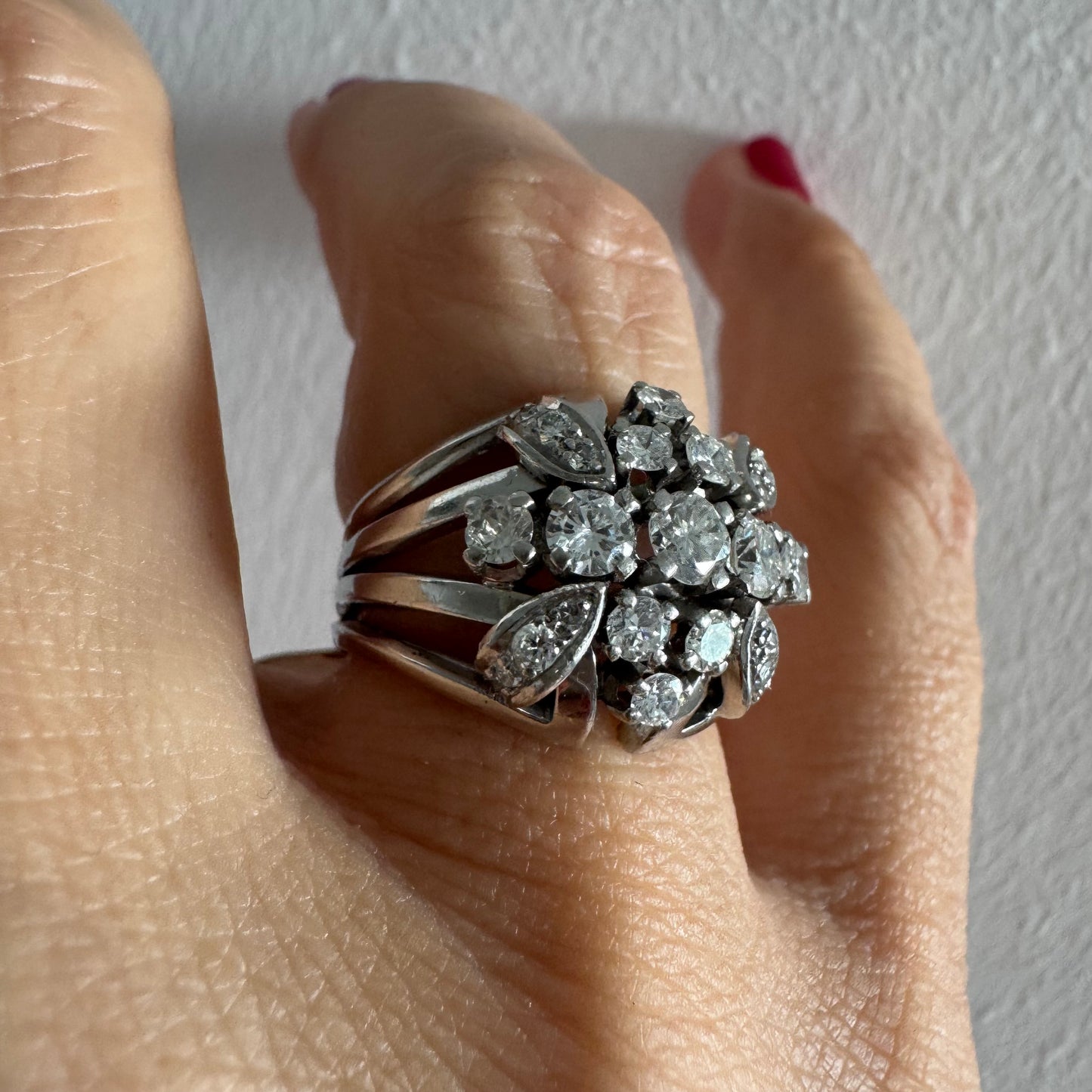 Platinum ring set with Diamonds in a bold, multi-layered floral design.