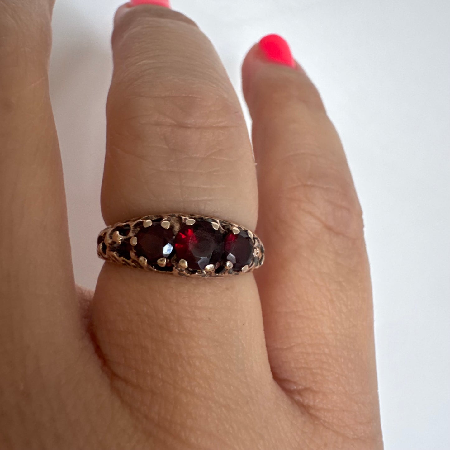 9K gold ring set with deep red Garnet stones