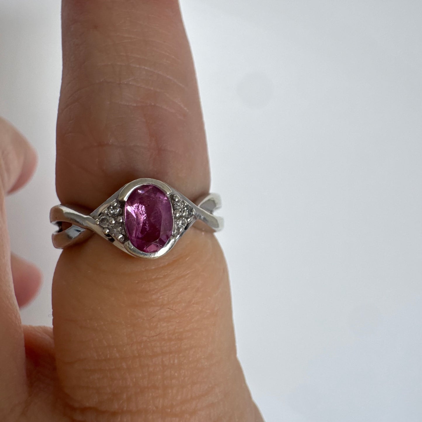 9K gold ring set with a pink center stone