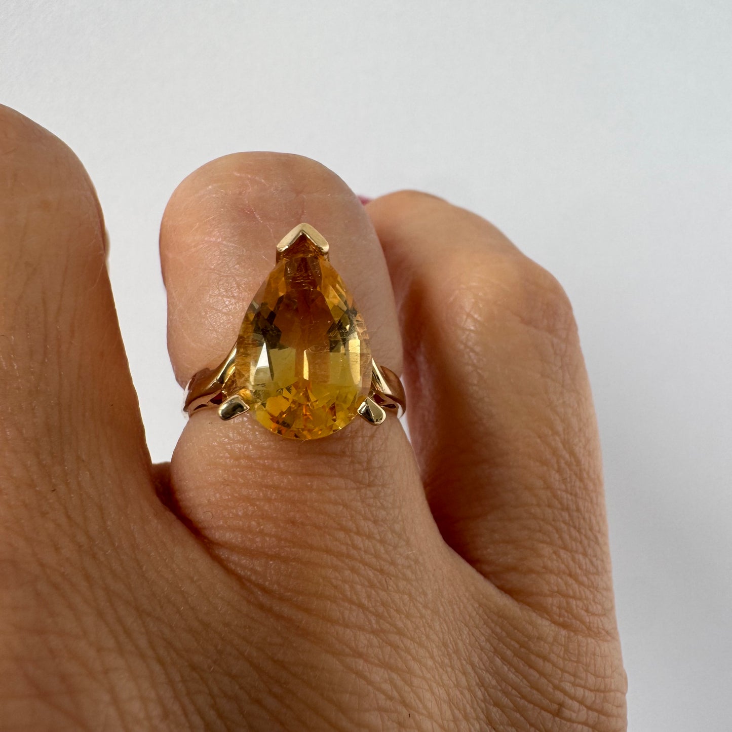 14K gold ring set with a large pear-shaped Citrine