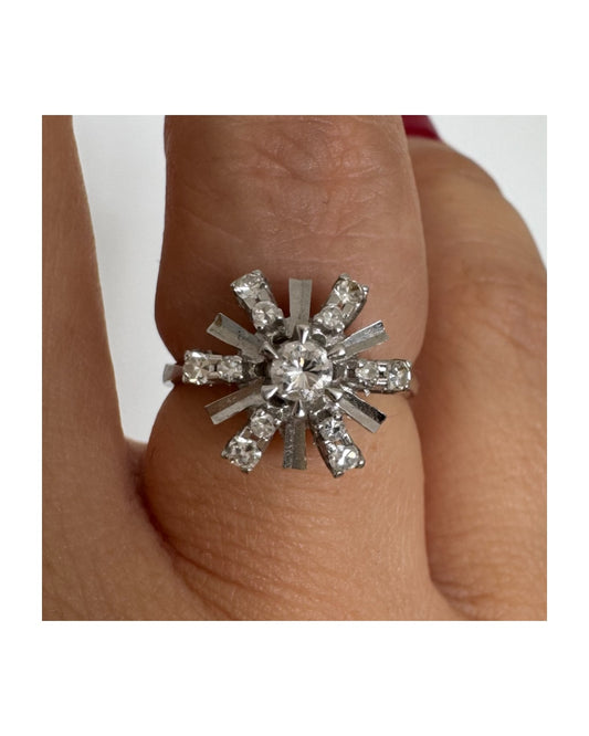 18K white gold ring designed as a radiant starburst, set with brilliant-cut diamonds that capture the light from every direction