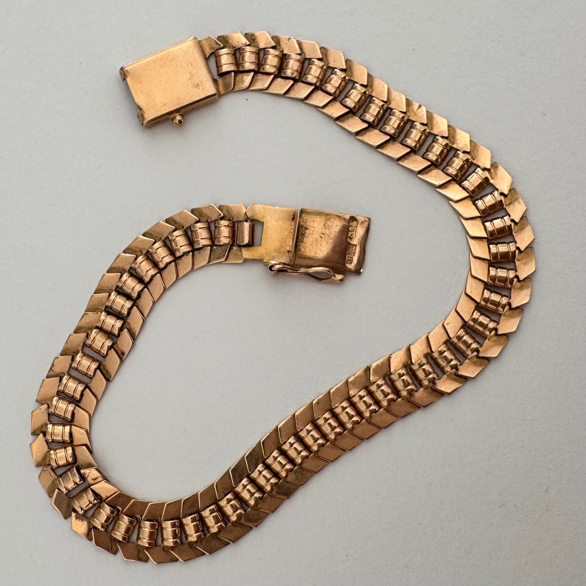 14K gold bracelet with a bold, flexible link design and a secure box clasp.