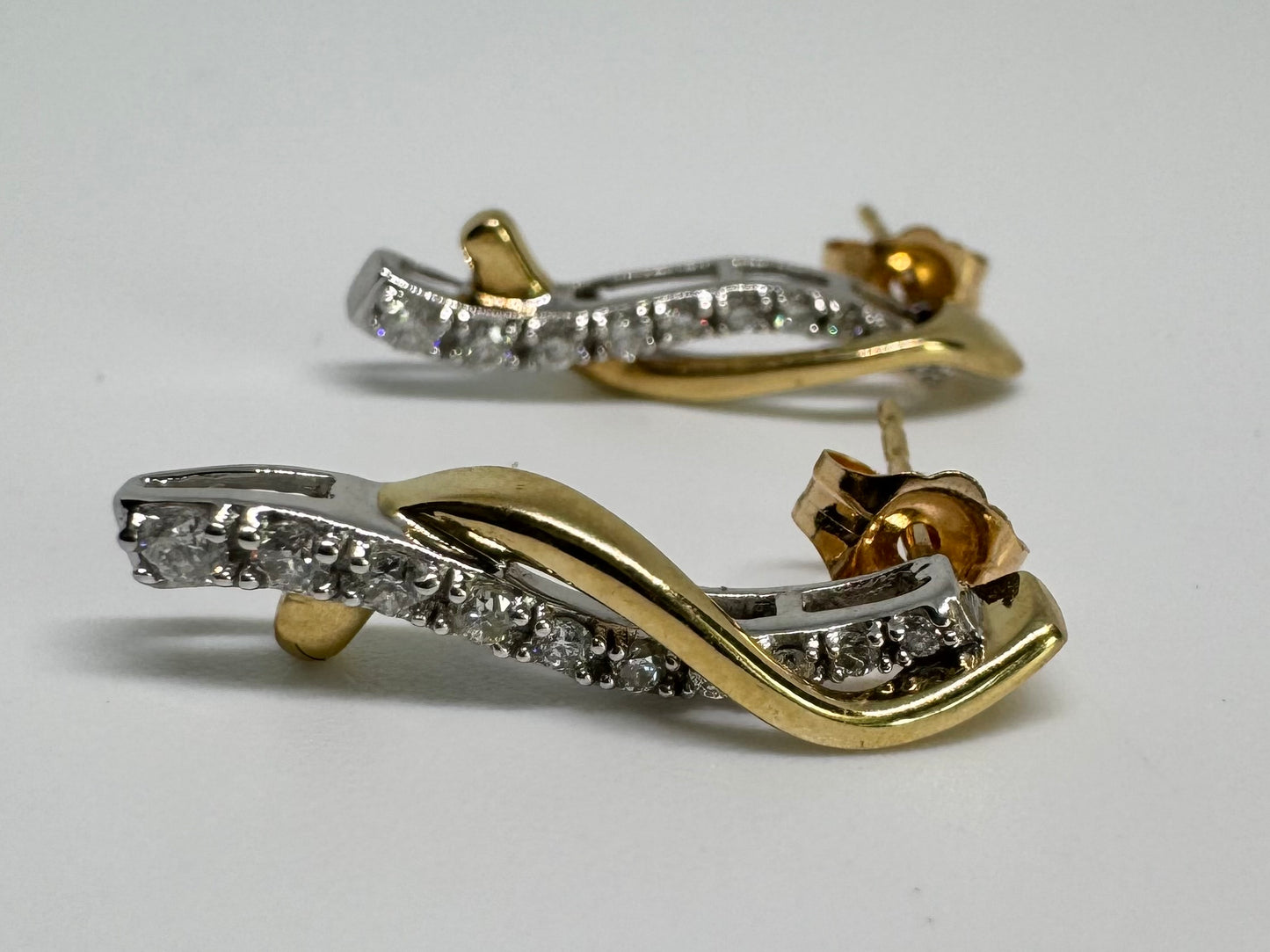 14K gold earrings set with Diamonds