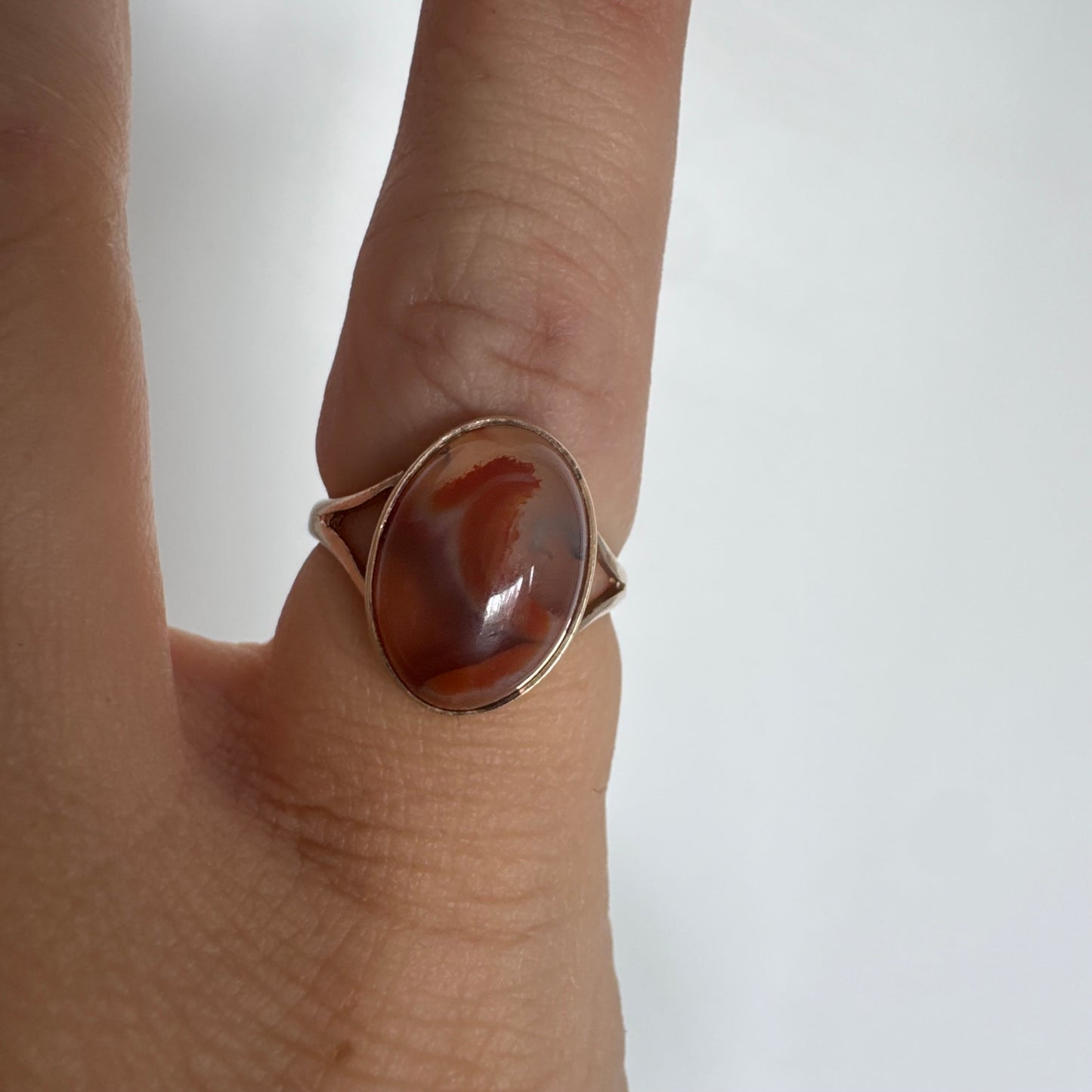 9K gold ring set with a warm reddish-brown stone featuring beautiful natural patterns