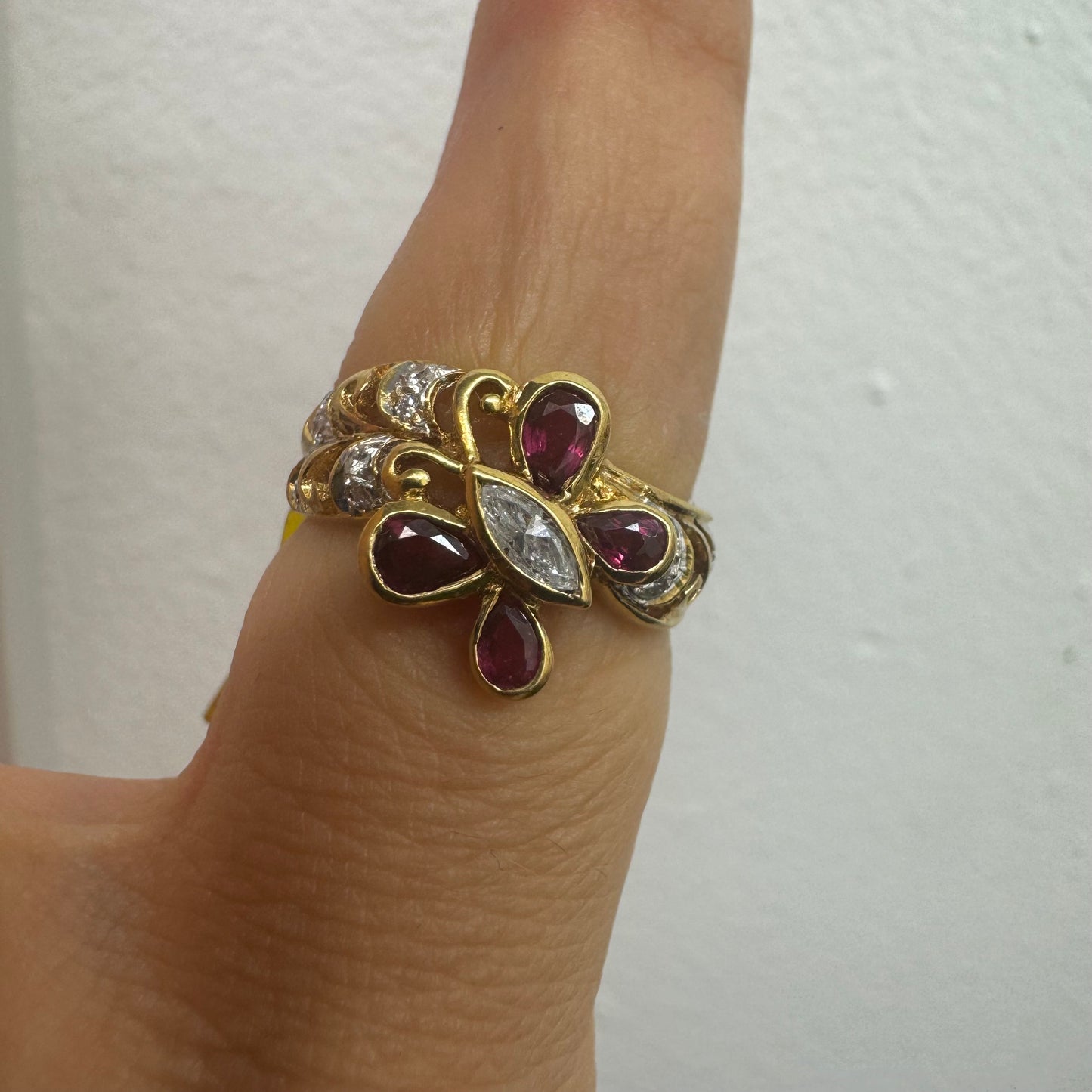 18K gold butterfly ring set with pear-cut Rubies & a marquise-cut Diamond at its center