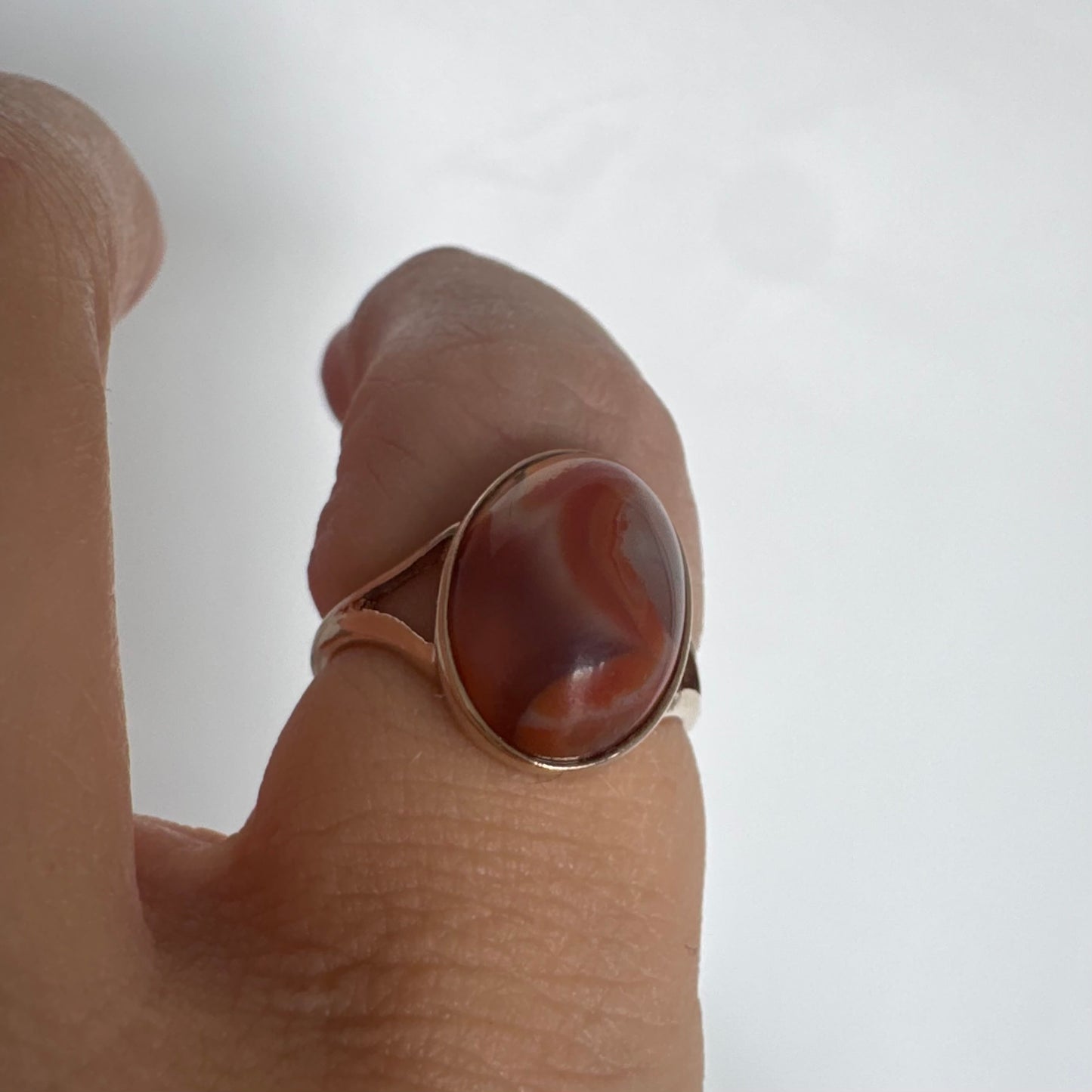 9K gold ring set with a warm reddish-brown stone featuring beautiful natural patterns