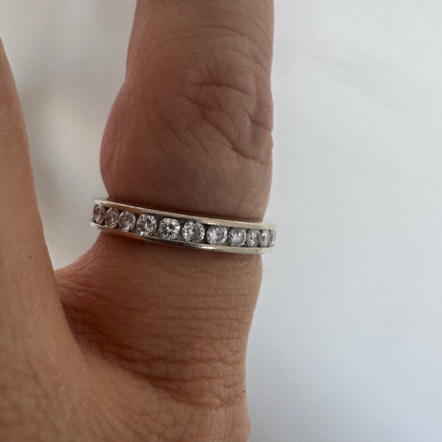 14K white gold eternity ring set with a row of sparkling Diamonds