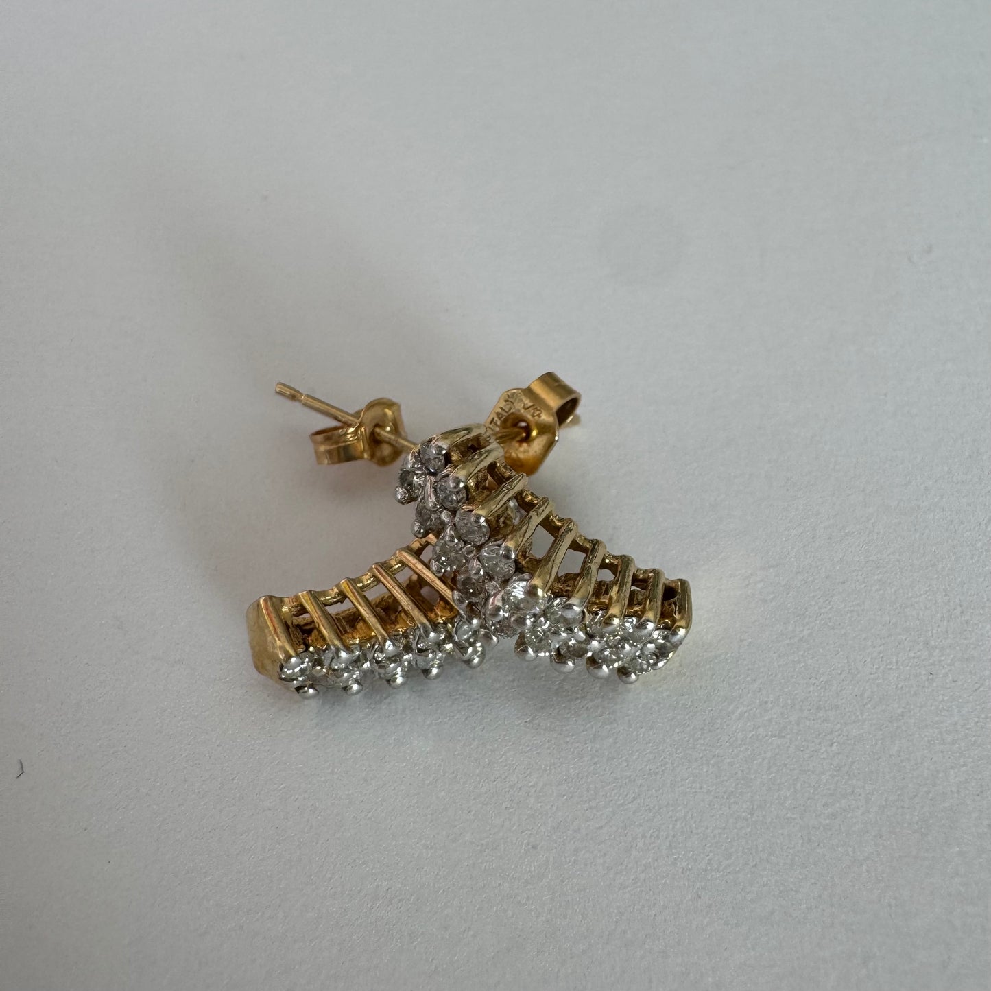 14K gold half-hoop earrings set with sparkling Diamonds in a dense pavé setting