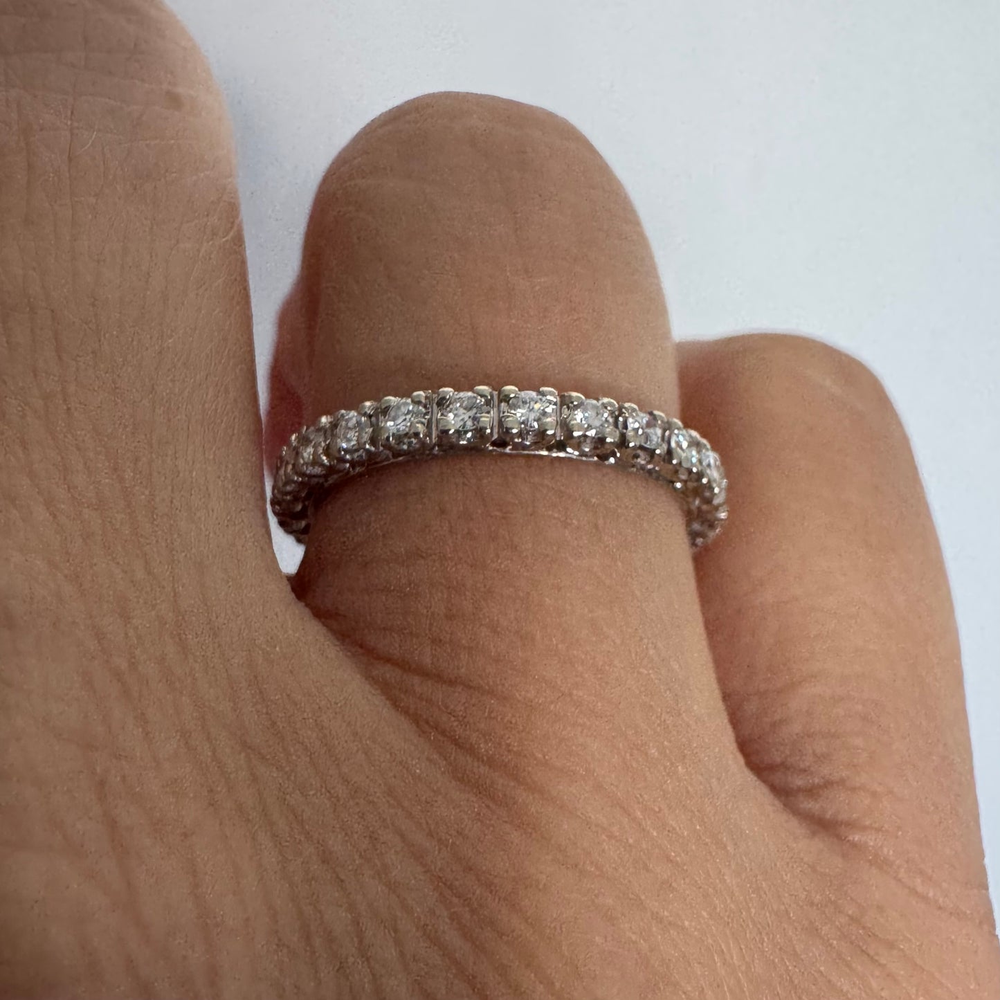 Classic 14K gold eternity ring set with a full circle of sparkling Diamonds