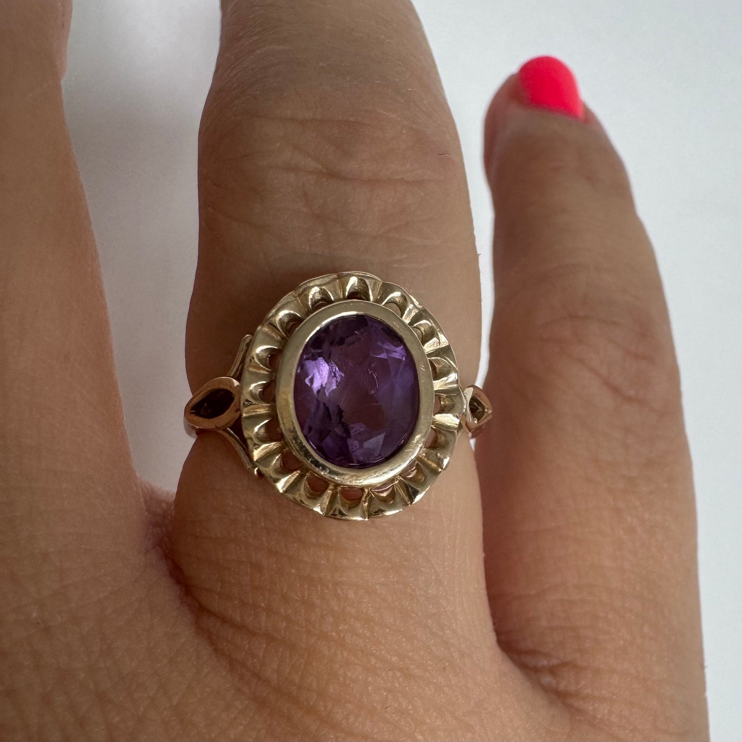 9K gold ring set with a mesmerizing deep purple Amethyst, framed by delicate details that give it a romantic and regal feel.
