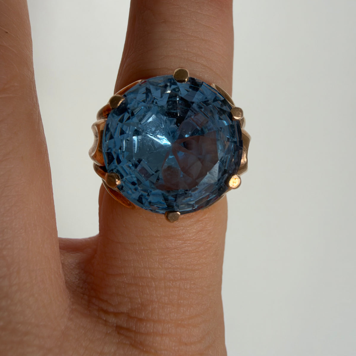 9K gold vintage ring with a large faceted blue topaz