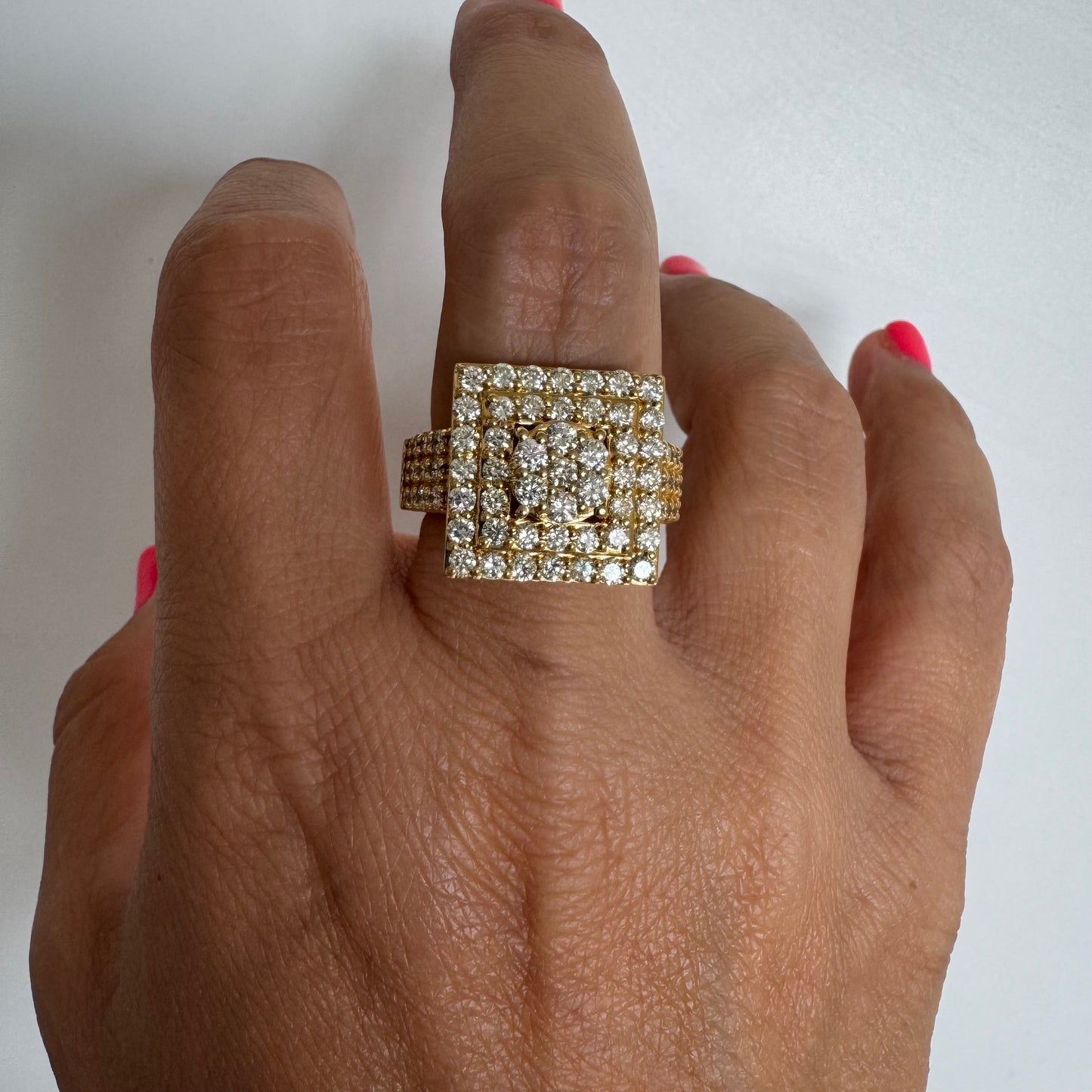 10K gold ring featuring a bold geometric design beautifully set with sparkling Diamonds