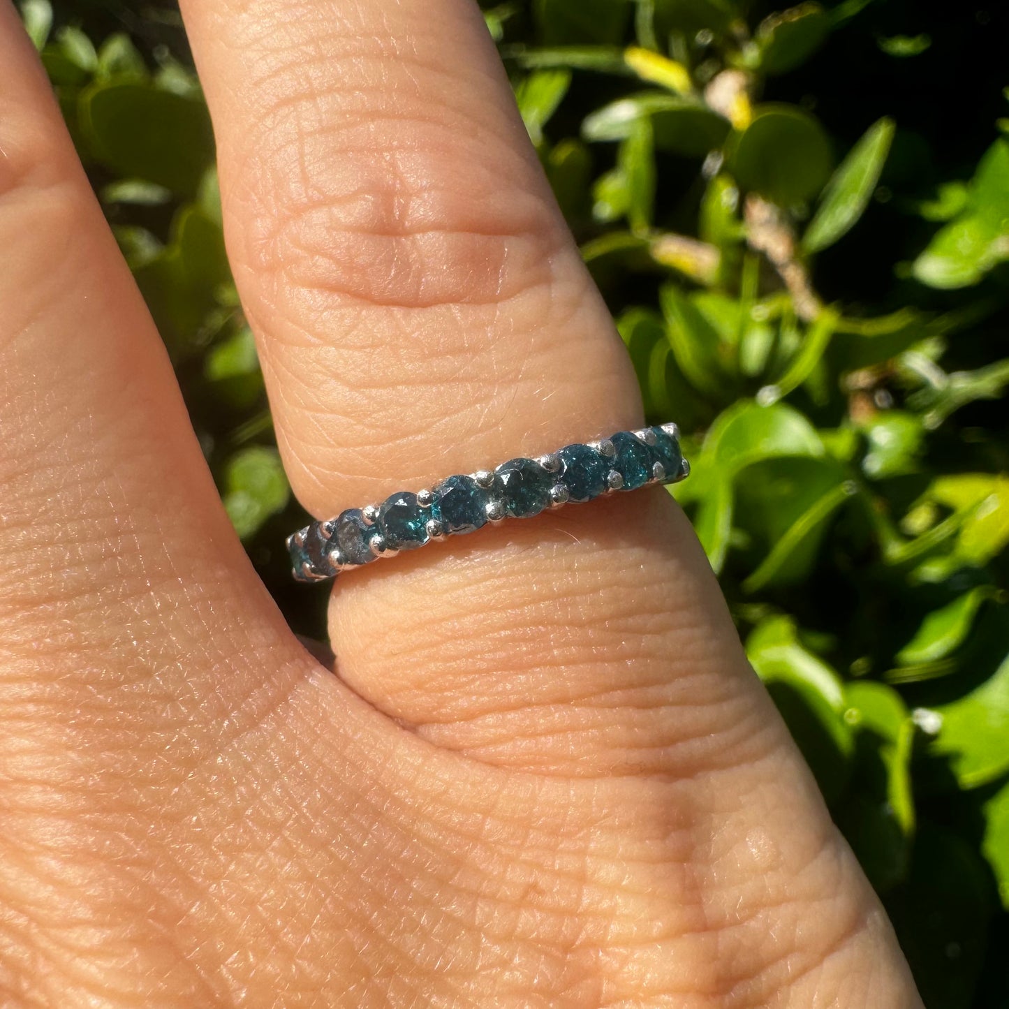 14K gold ring set with Blue Diamonds