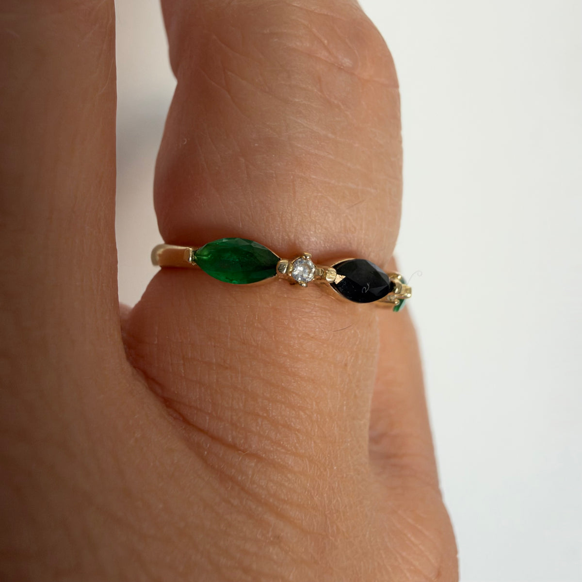14K yellow gold vintage ring with a marquise-cut sapphire and emeralds