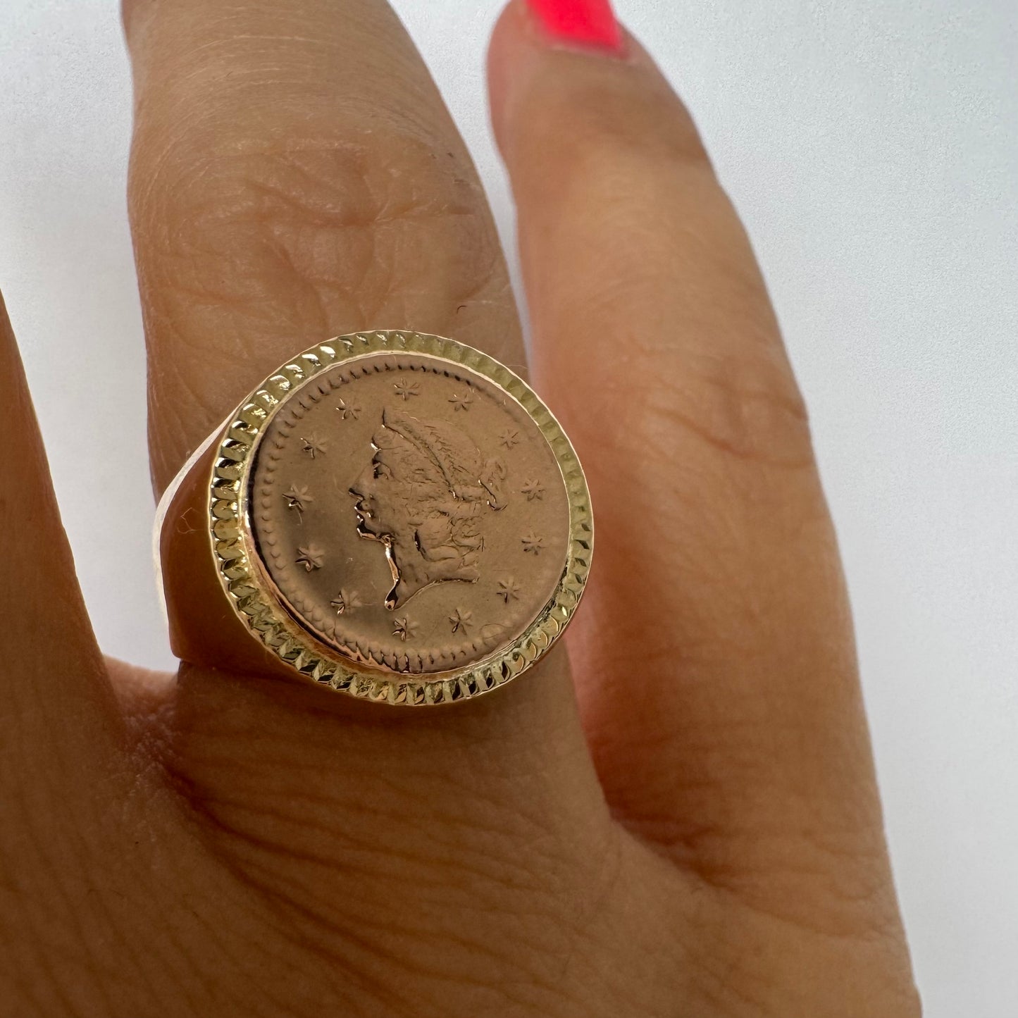 18K gold coin ring set with an authentic 22K gold coin at the center.