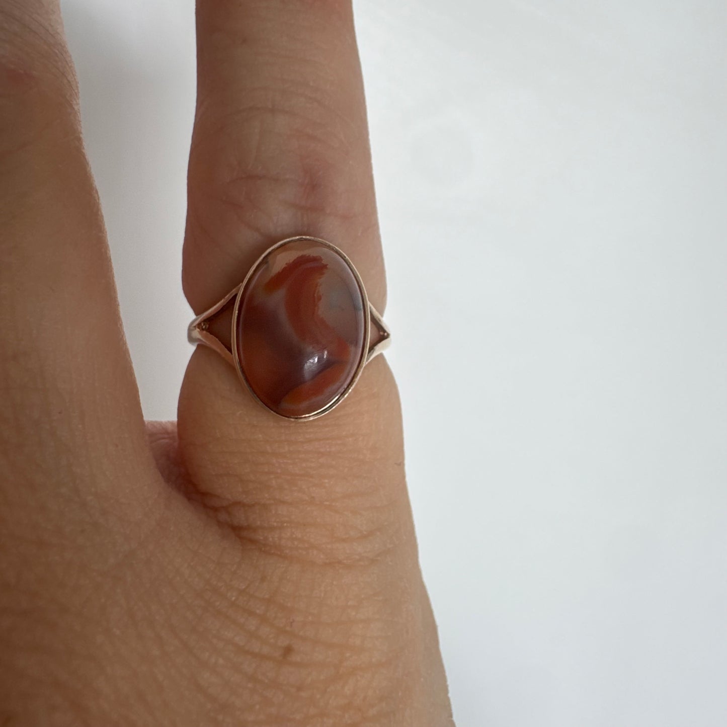 9K gold ring set with a warm reddish-brown stone featuring beautiful natural patterns