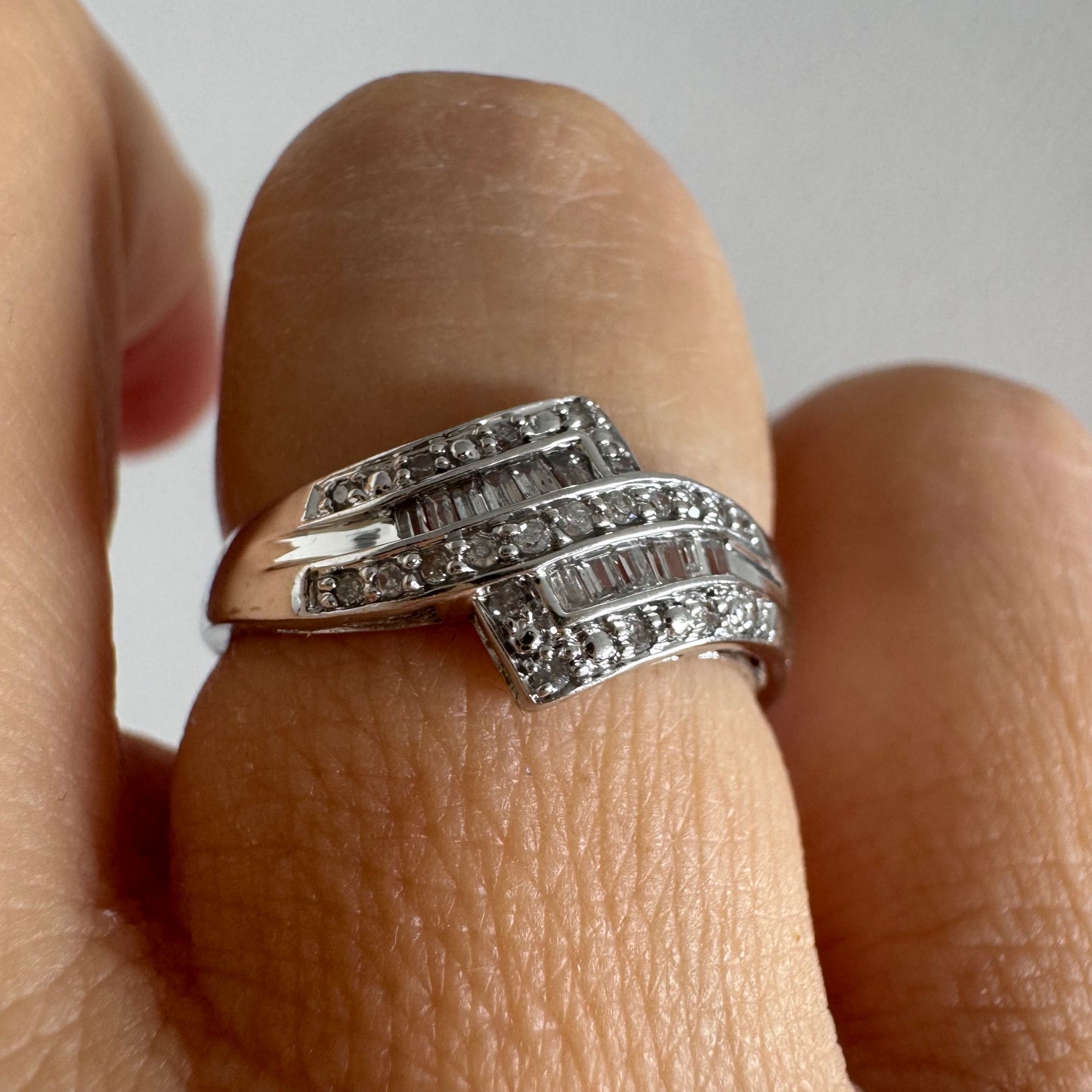 9K gold ring set with natural Diamonds in a unique geometric design.