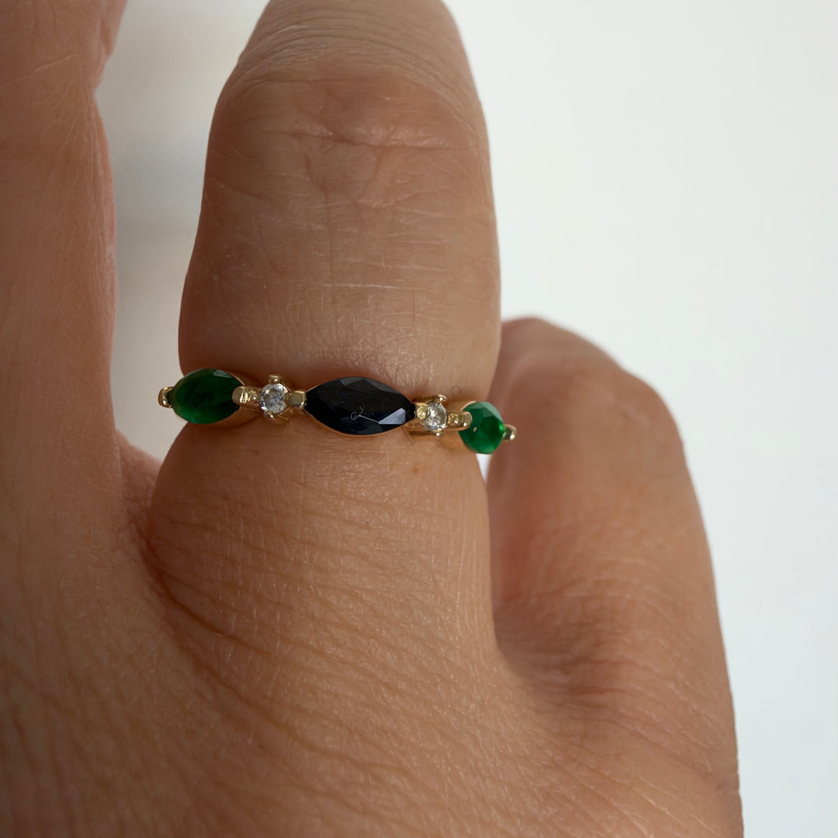 14K yellow gold vintage ring with a marquise-cut sapphire and emeralds