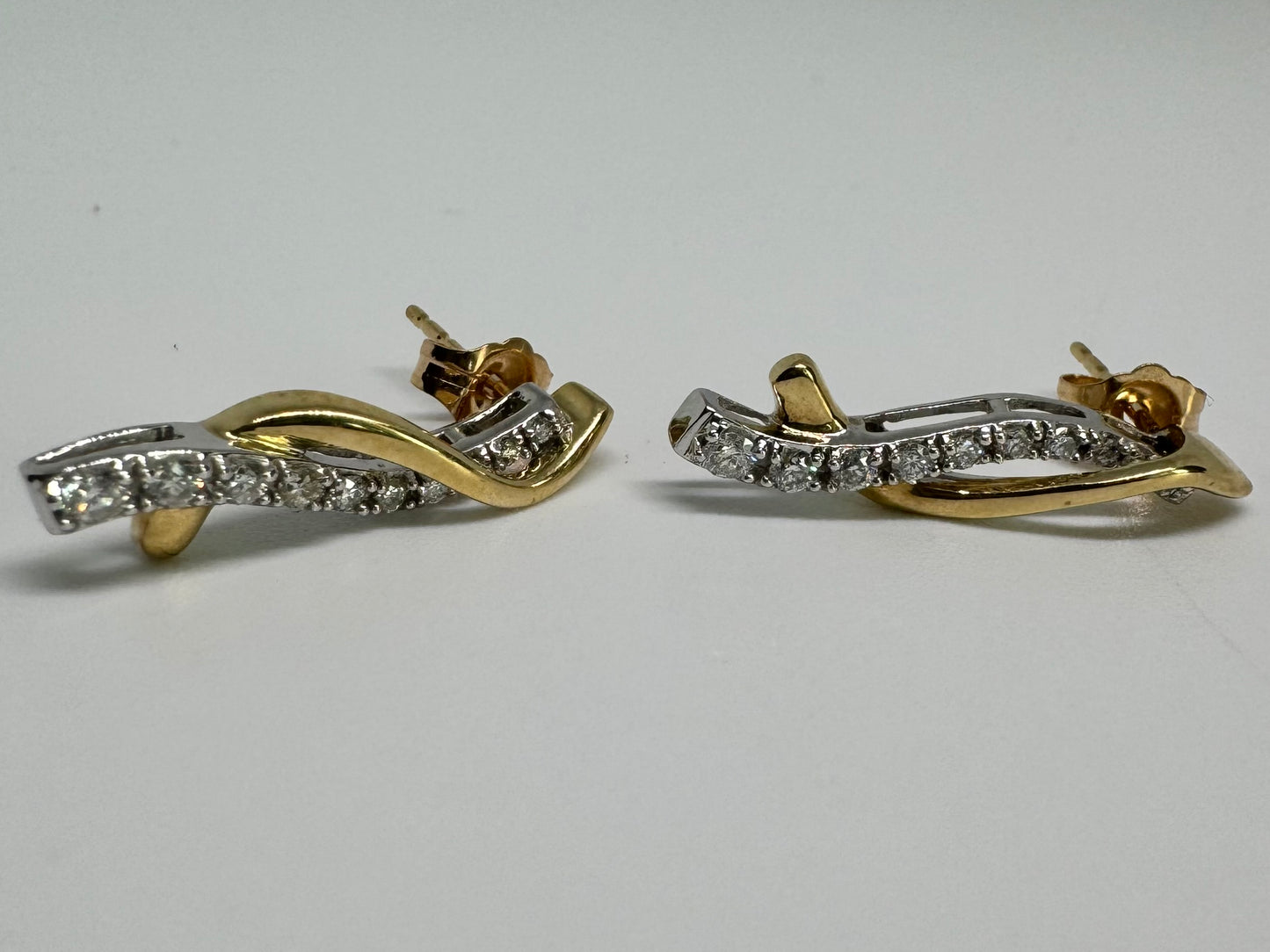 14K gold earrings set with Diamonds