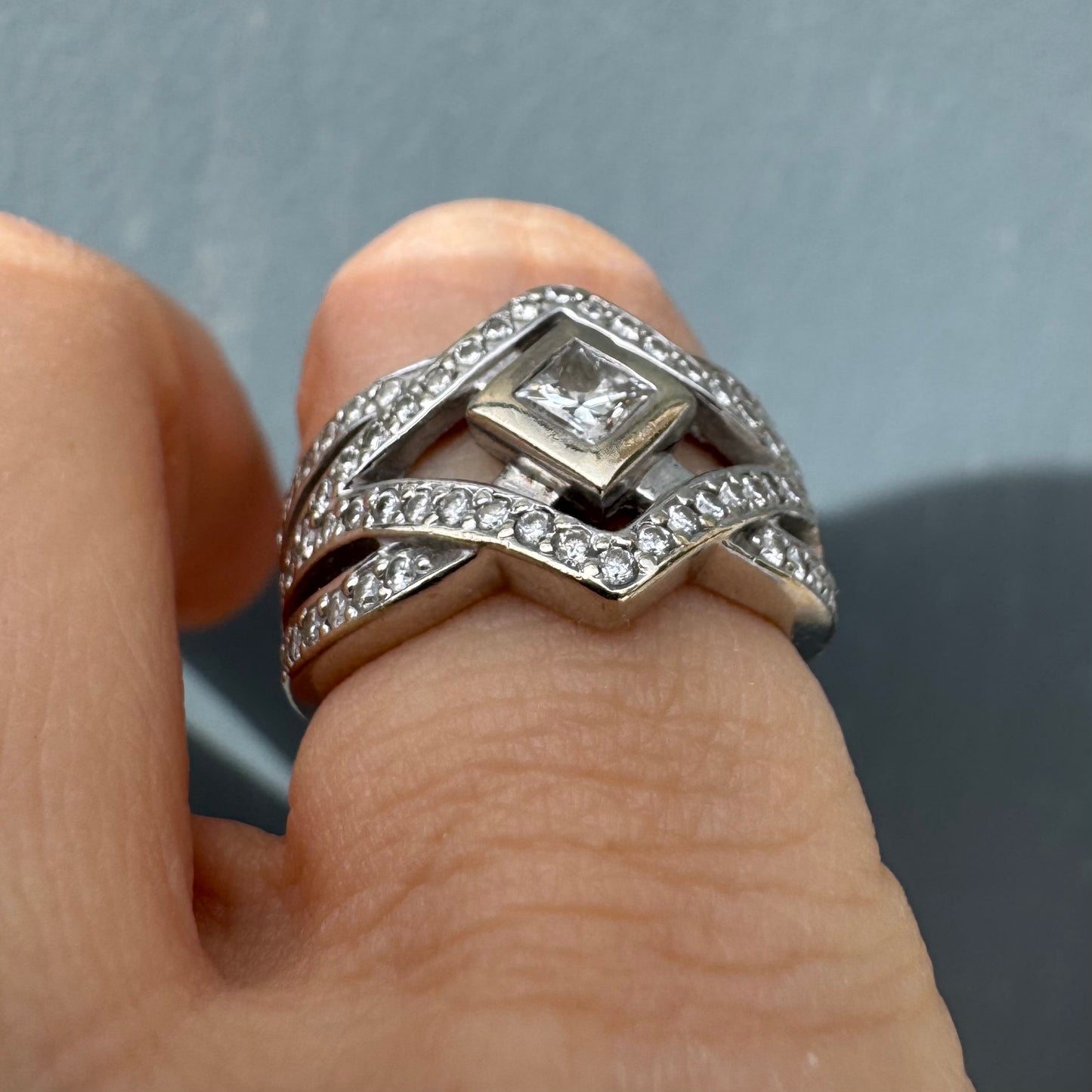 14K gold diamond ring featuring a luxurious geometric Art-Deco inspired design.