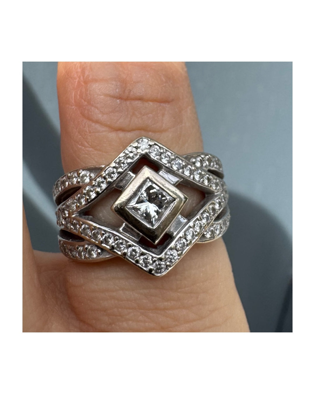 14K gold diamond ring featuring a luxurious geometric Art-Deco inspired design.