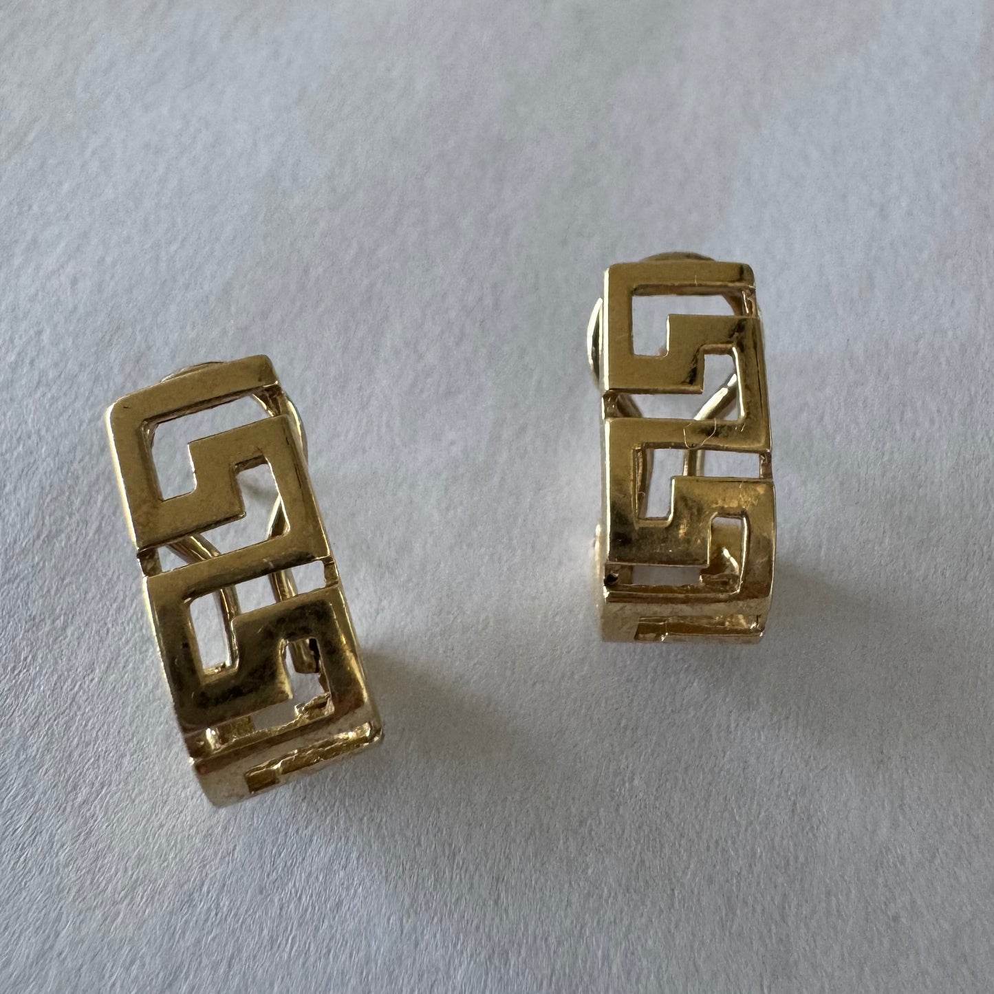 14K gold earrings featuring a geometric design