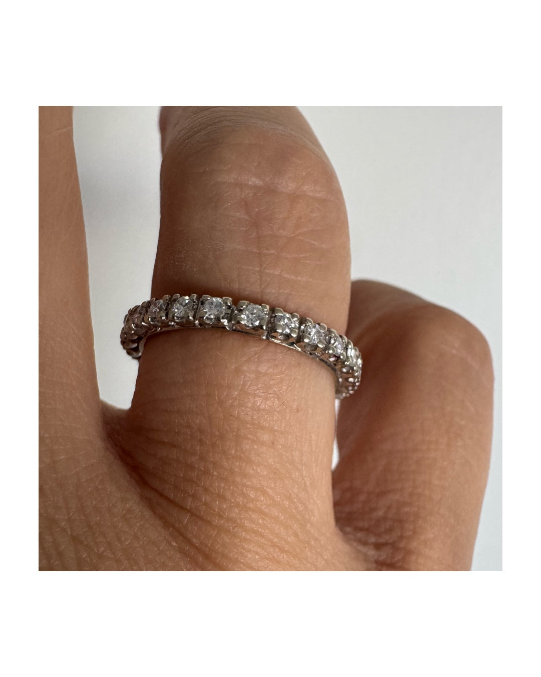 Classic 14K gold eternity ring set with a full circle of sparkling Diamonds
