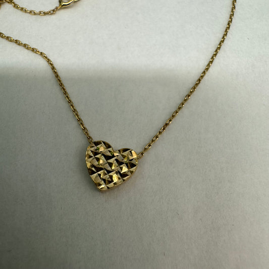 14K gold necklace featuring a heart-shaped pendant with a delicate geometric texture