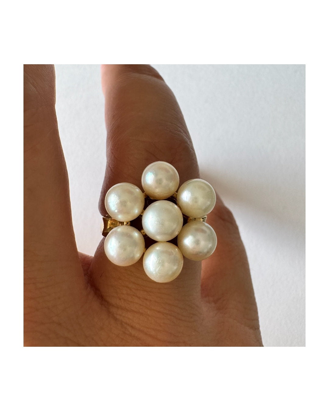 14K gold ring set with seven round Pearls in a bold floral cluster