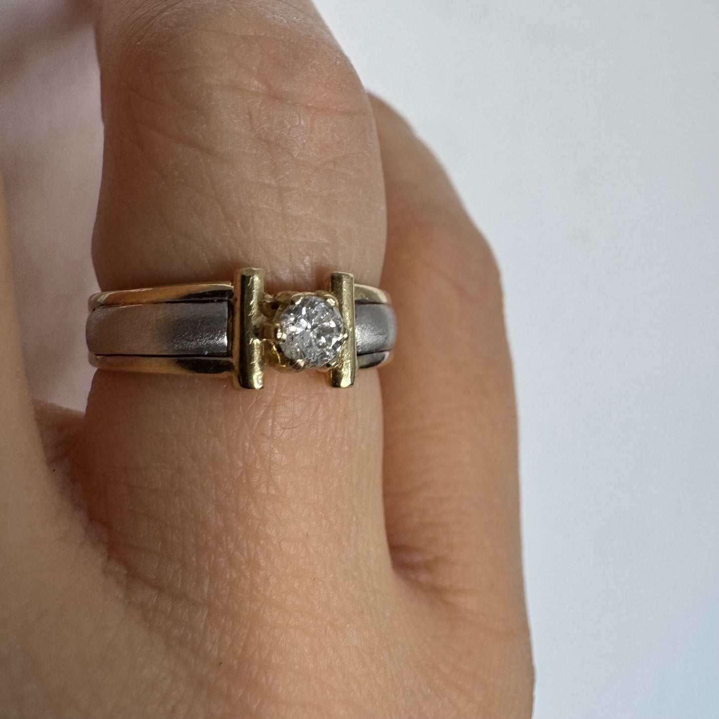 14K two-tone gold ring set with one center Diamond