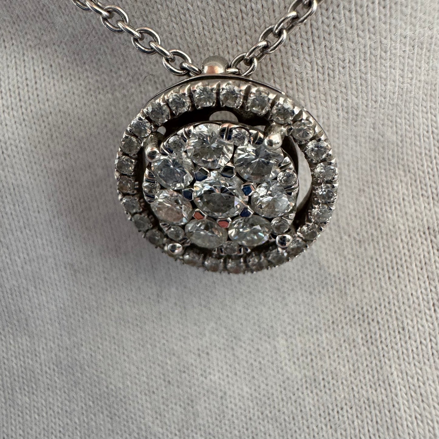 14K gold necklace featuring a round pendant set with a cluster of sparkling Diamonds