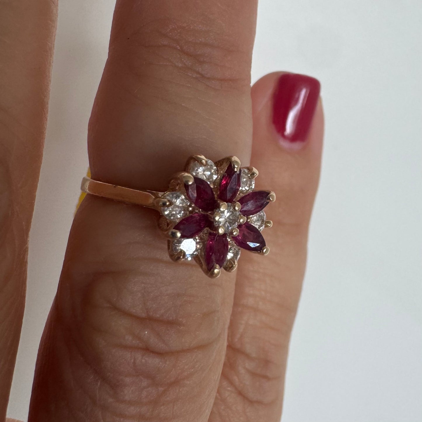 14K gold ring featuring a classic floral-inspired design set with marquise-cut Rubies & Diamonds.