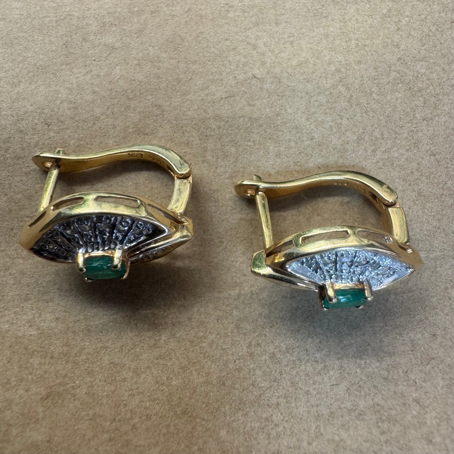 14K gold drop earrings in a refined leaf design, set with vivid green Emeralds at the center and shimmering pavé-set Diamonds along the curves