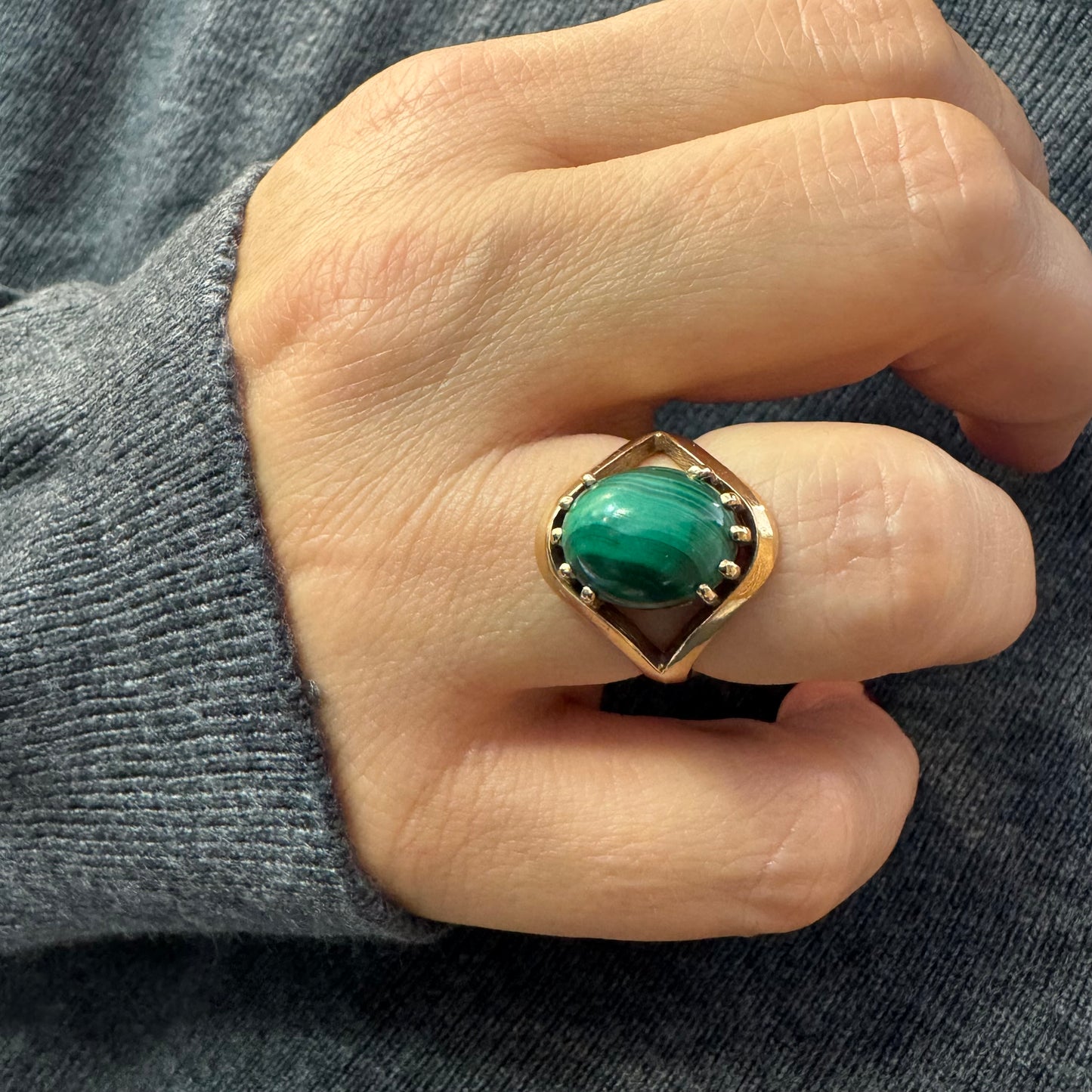 14K gold ring set with a polished Malachite cabochon