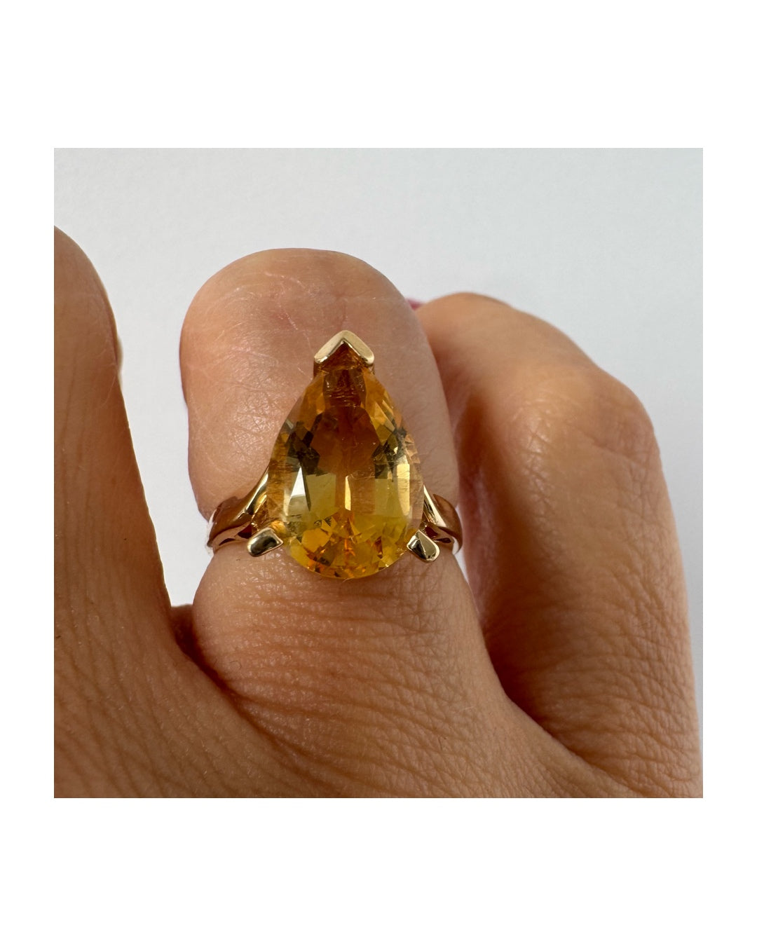 14K gold ring set with a large pear-shaped Citrine