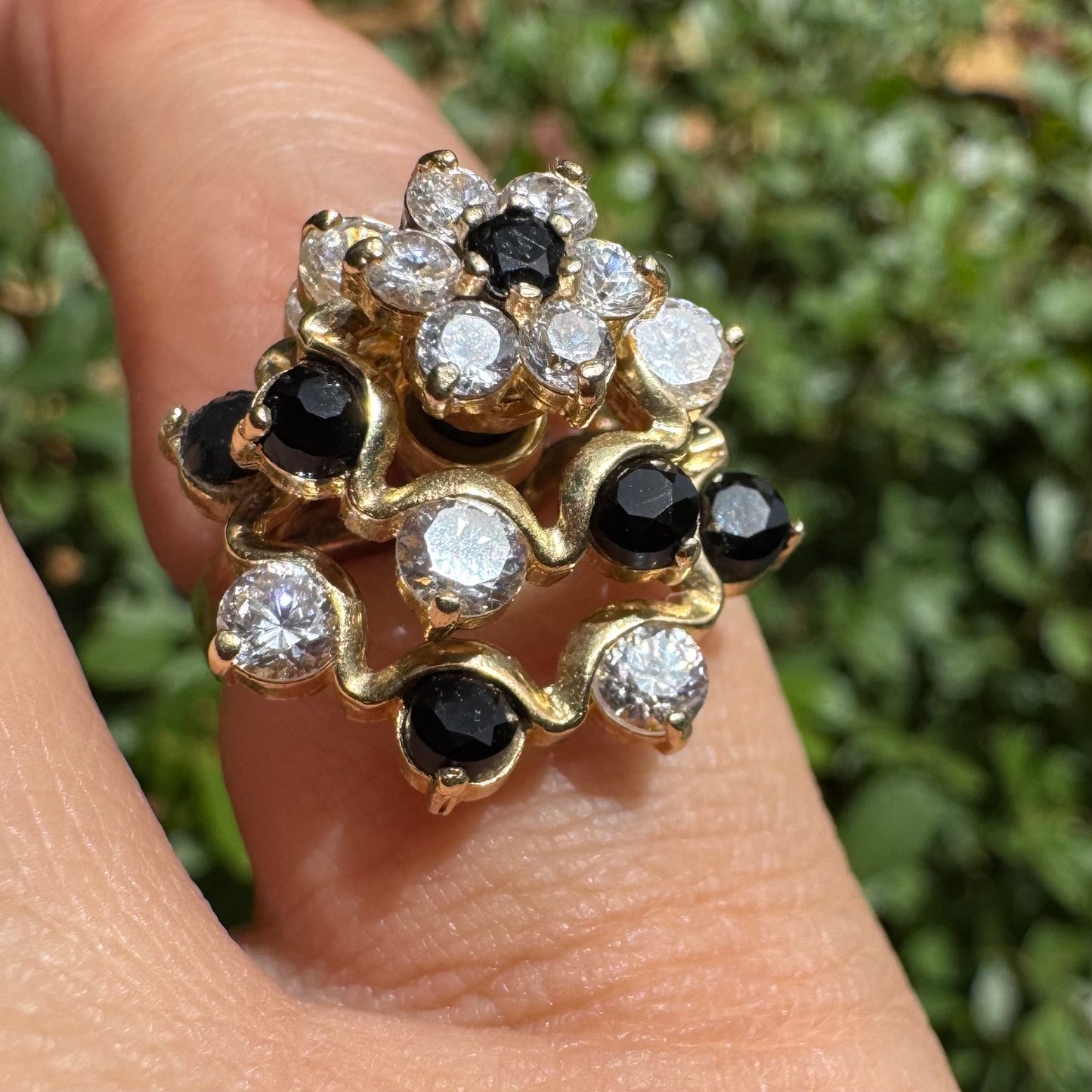 14K gold kinetic cocktail ring set with black and transparent stones