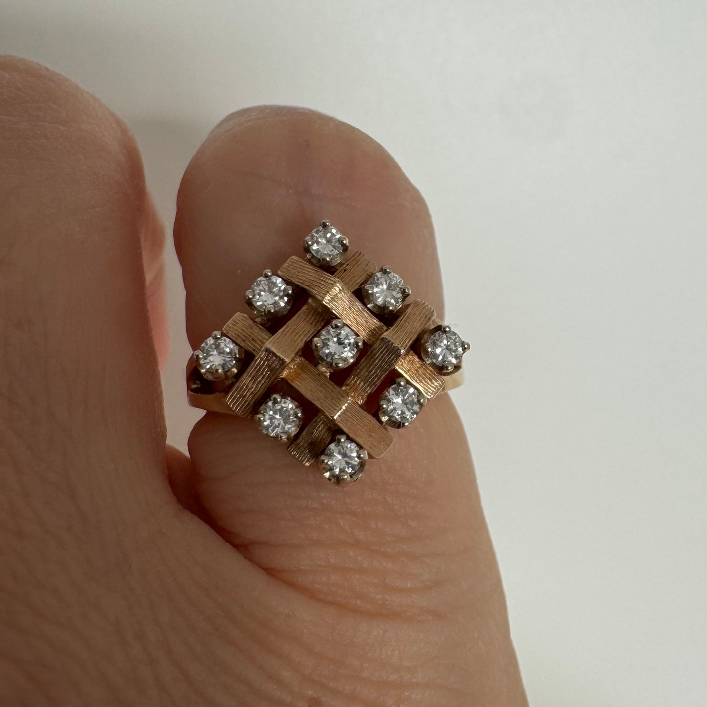 14K gold woven-style ring set with round Diamonds in a symmetrical layout.