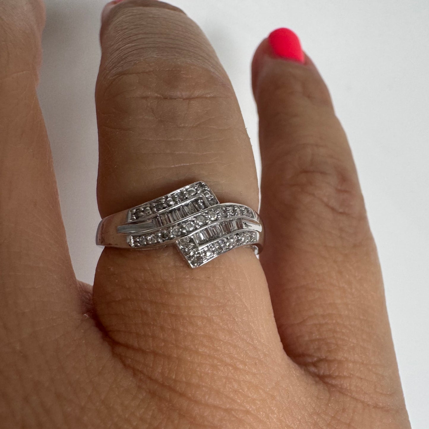 9K gold ring set with natural Diamonds in a unique geometric design.