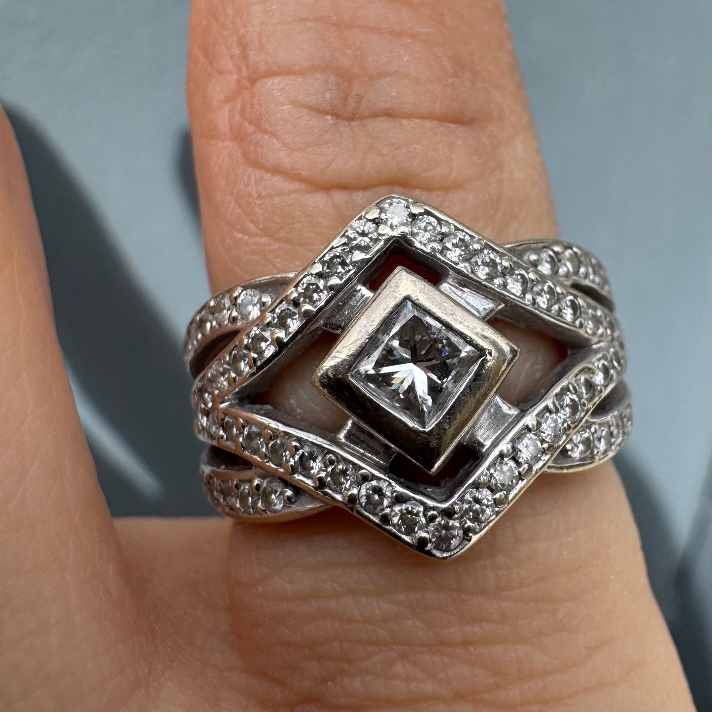 14K gold diamond ring featuring a luxurious geometric Art-Deco inspired design.