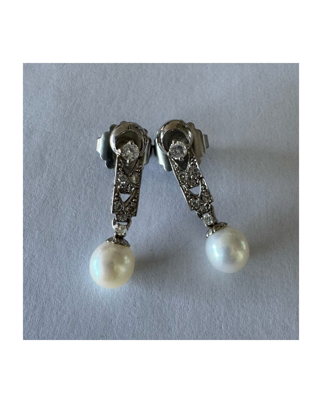 14K gold drop earrings set with Diamonds and a dangling Pearl.