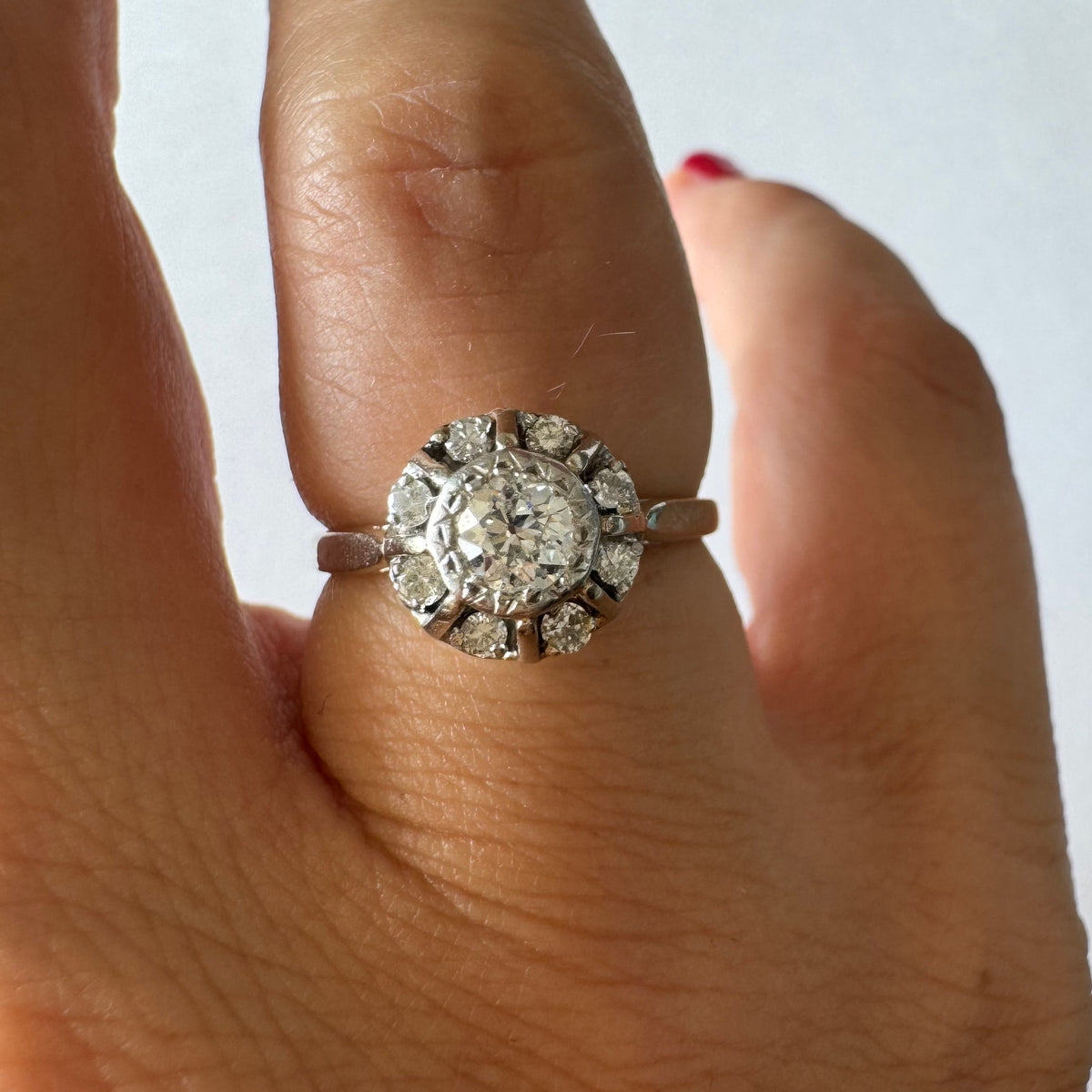 18K gold ring set with Diamonds in     a classic cluster-style