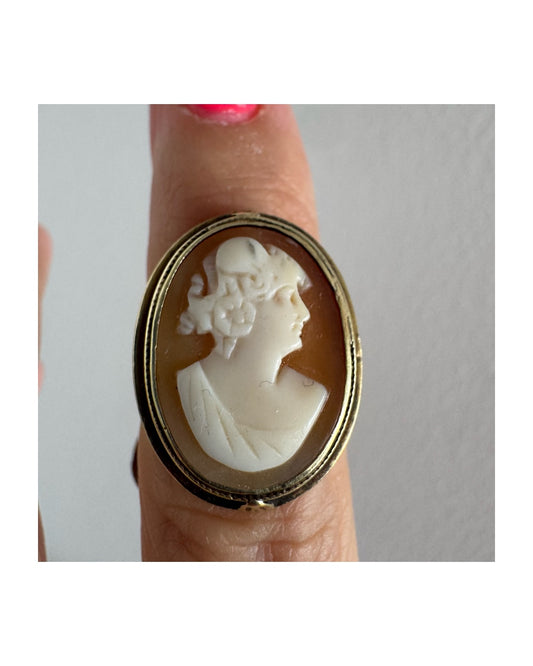 14K gold cameo ring featuring a finely carved portrait of a woman in profile, set in an oval bezel with intricate gold detailing