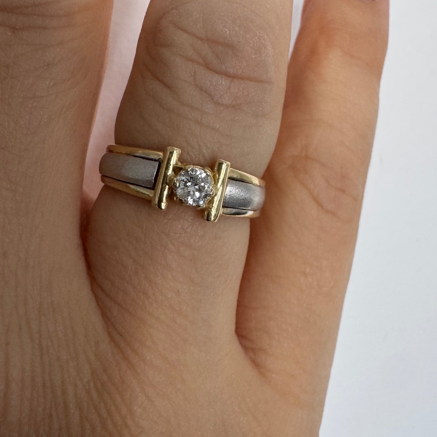 14K two-tone gold ring set with one center Diamond