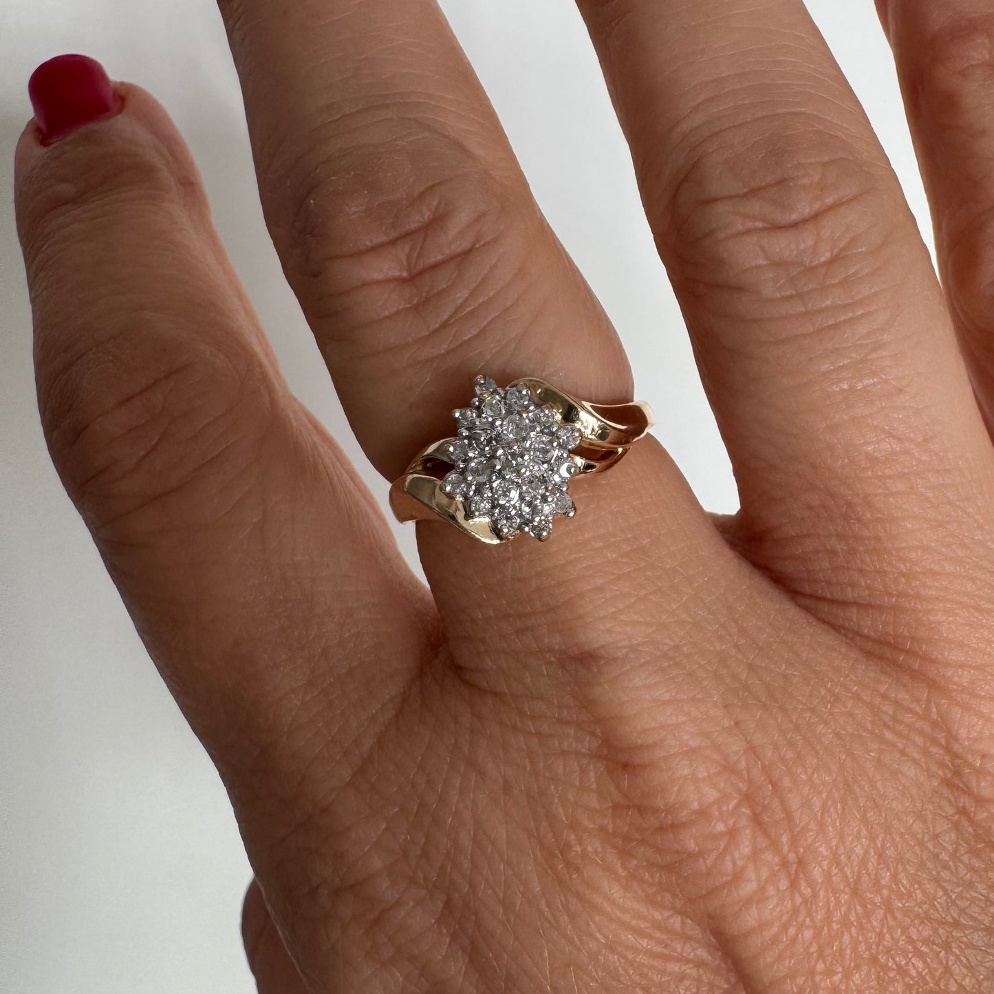 10K gold ring set with Diamonds, featuring a classic design with soft, flowing curves.