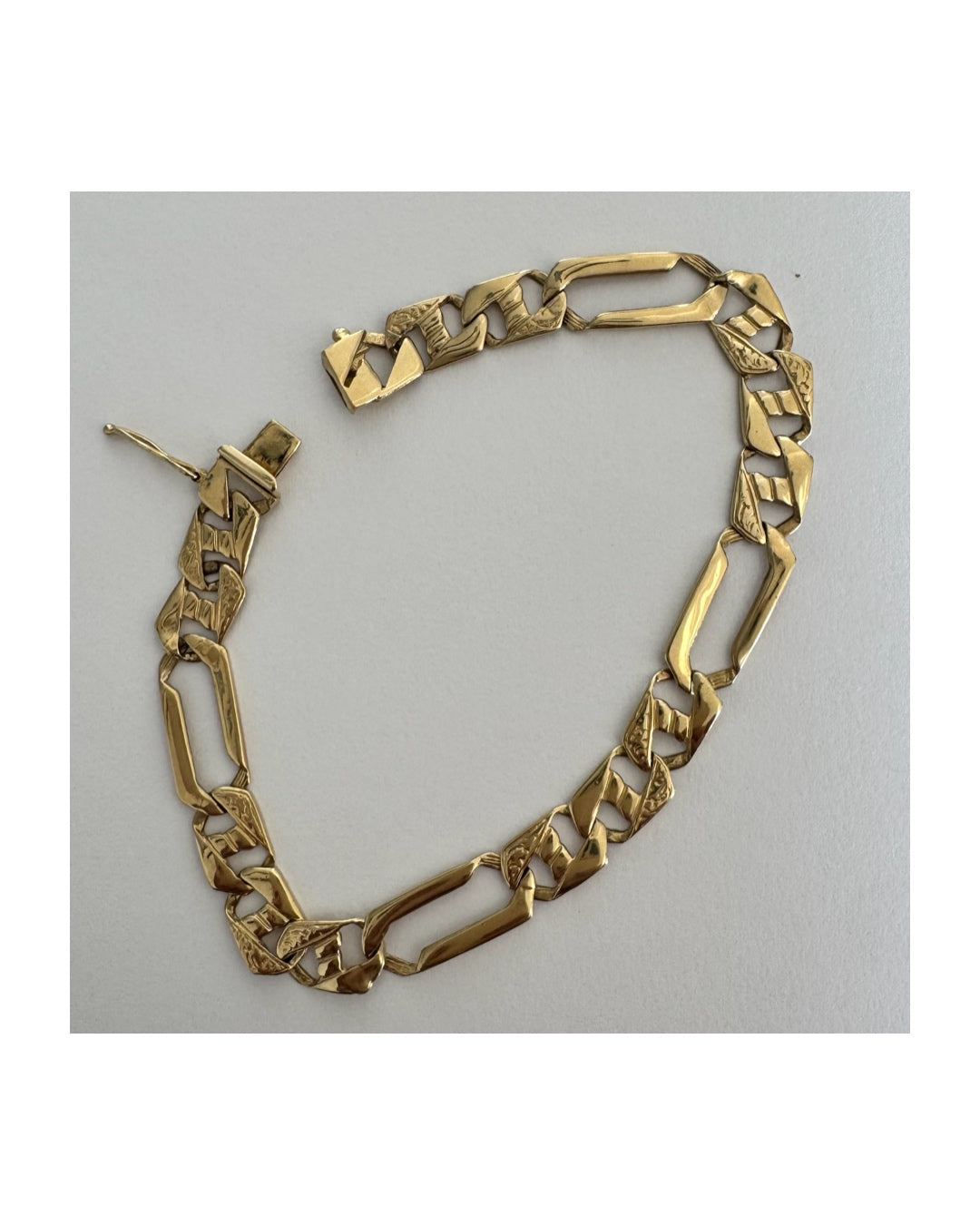 14K gold bracelet with a modern, distinctive link design