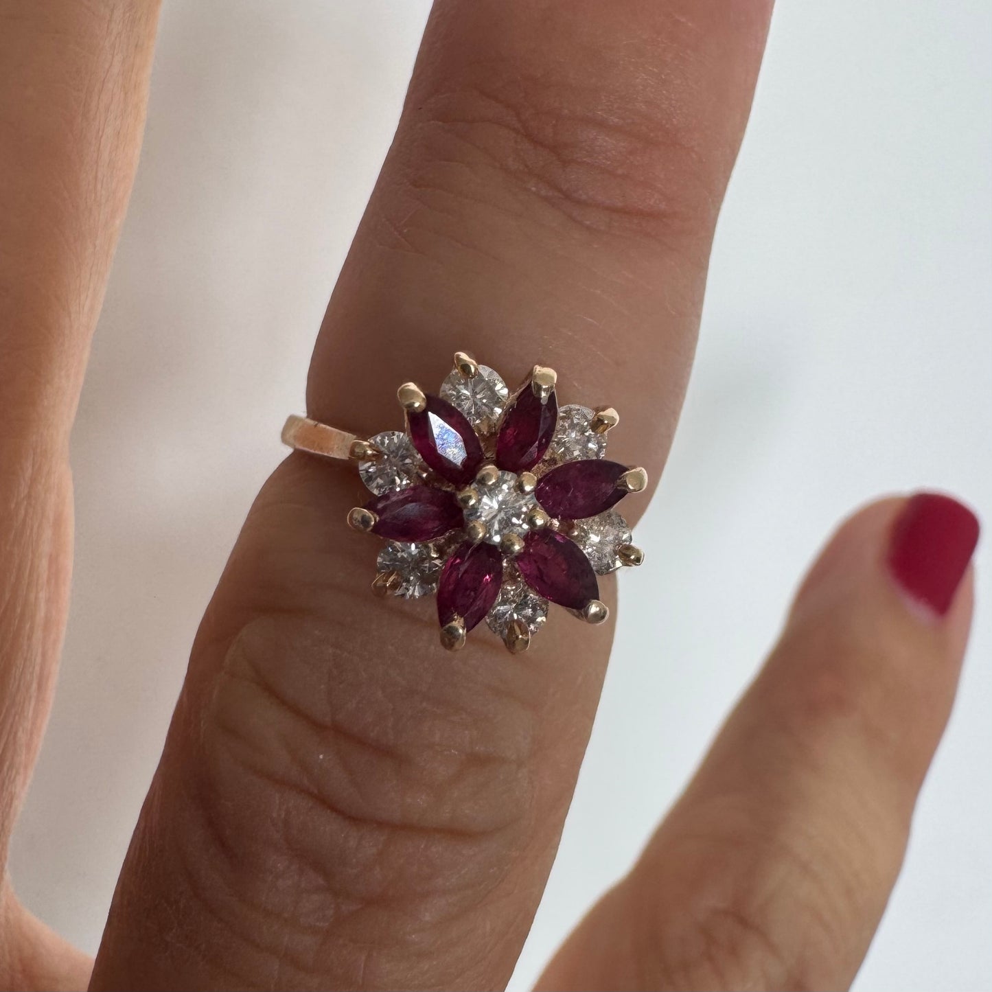 14K gold ring featuring a classic floral-inspired design set with marquise-cut Rubies & Diamonds.